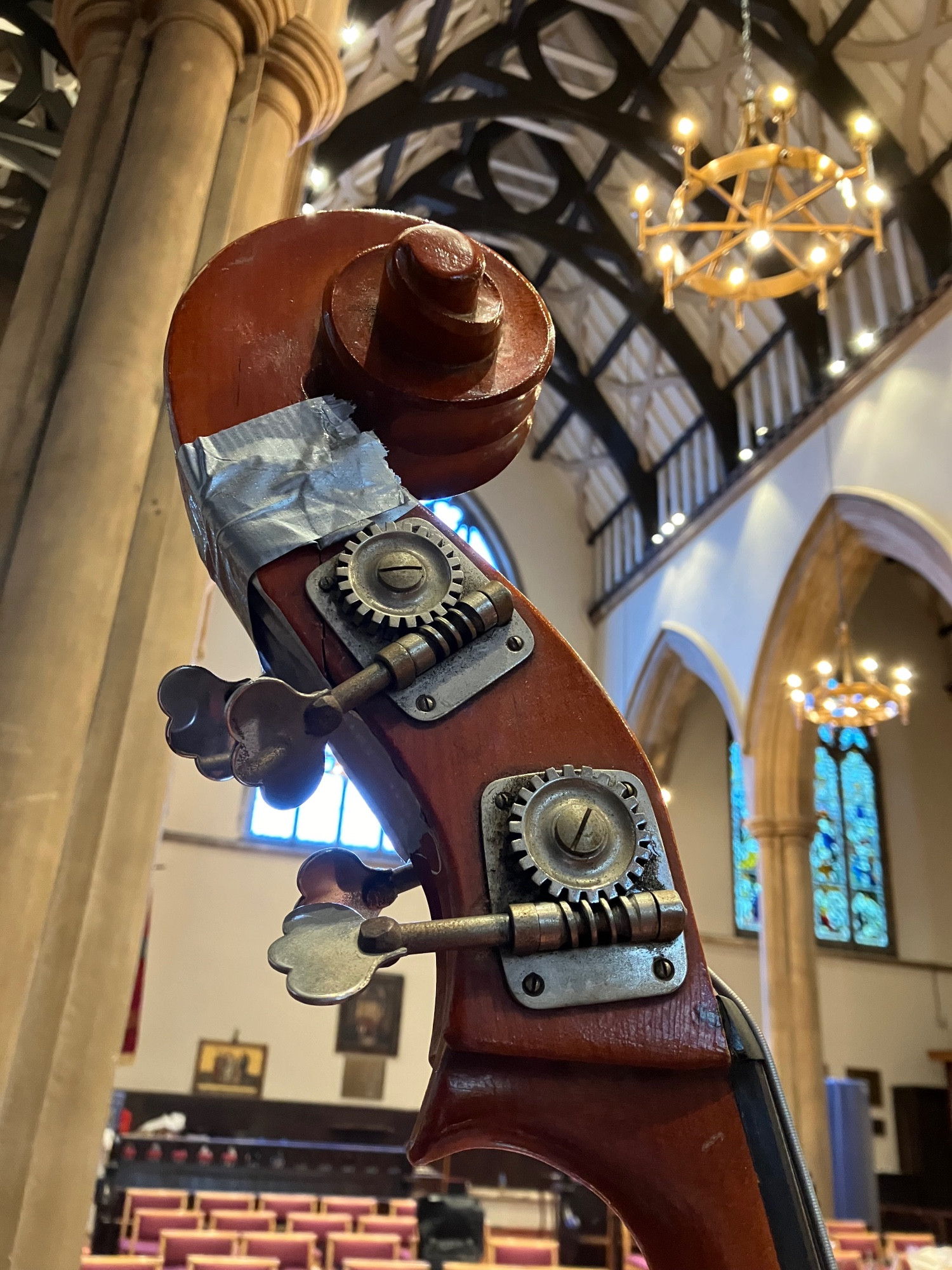 Double bass with gaffer tape around the scroll