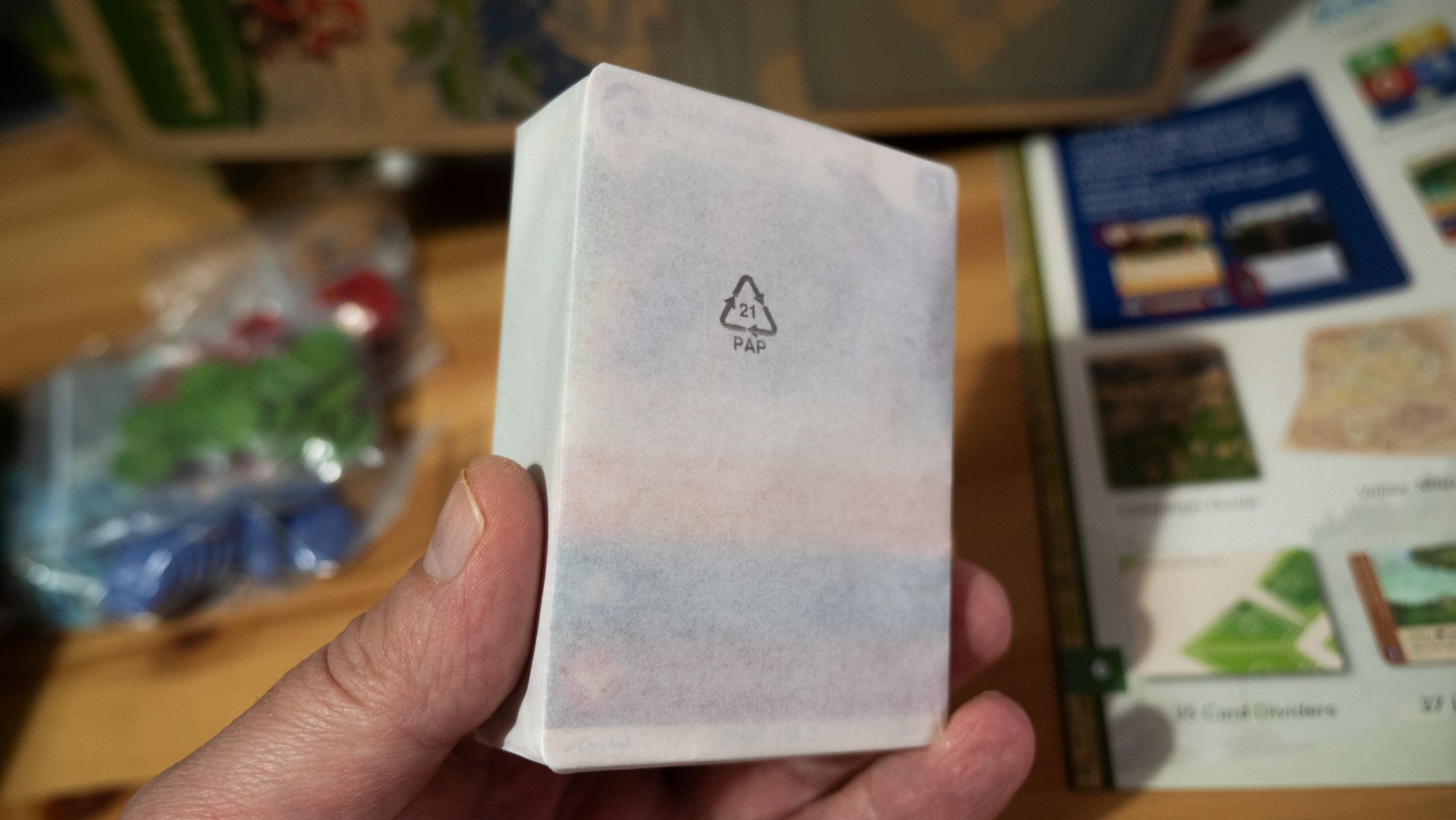 a pack of cards, wrapped in paper at manufacturer, rather than plastic shrinkwrap. it looks lush.