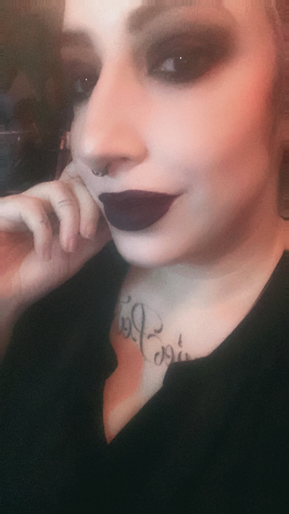 Goth woman in black lipstick ready to stream on twitch