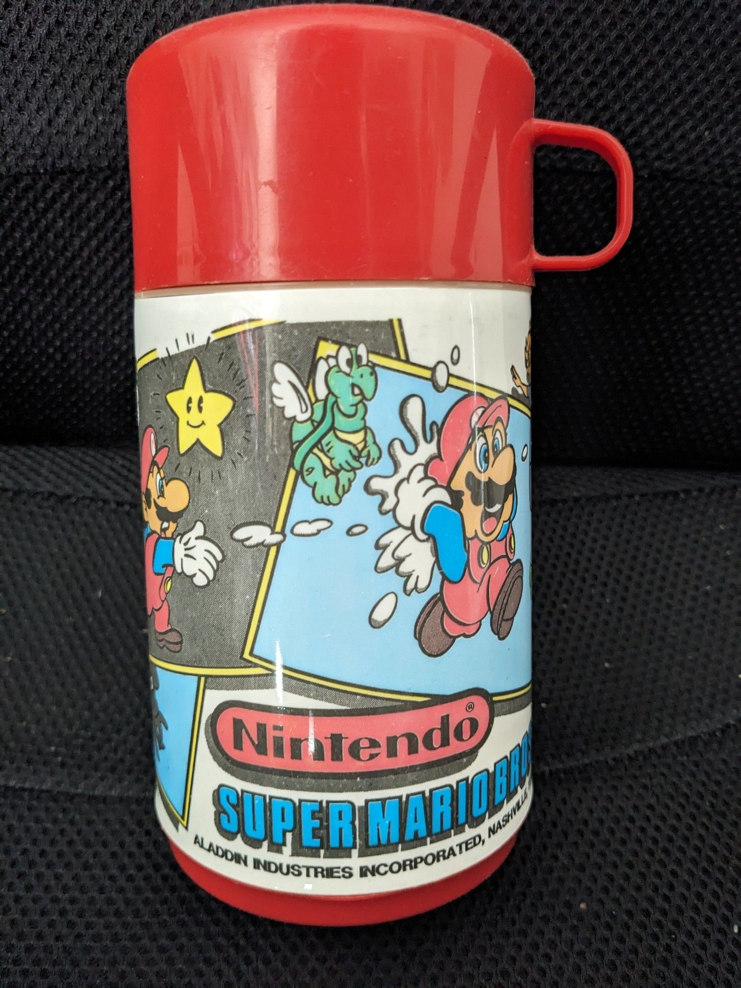 A thermos showing Mario throwing snowballs, collecting stars, and running from off-model paratroopas.