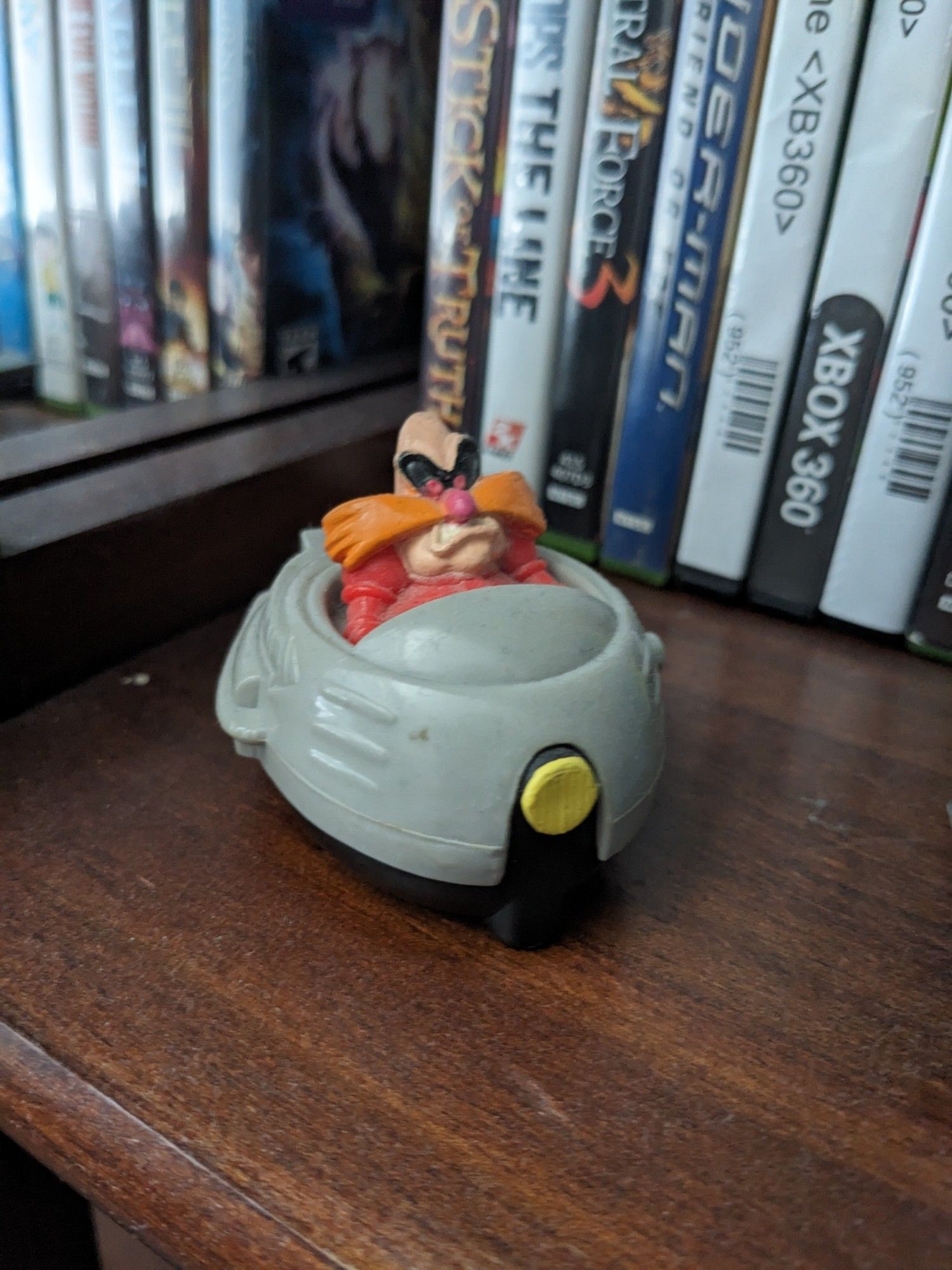 A winding toy of Robotnik in a hovercraft. It uses the classic Robotnik design and looks its age.