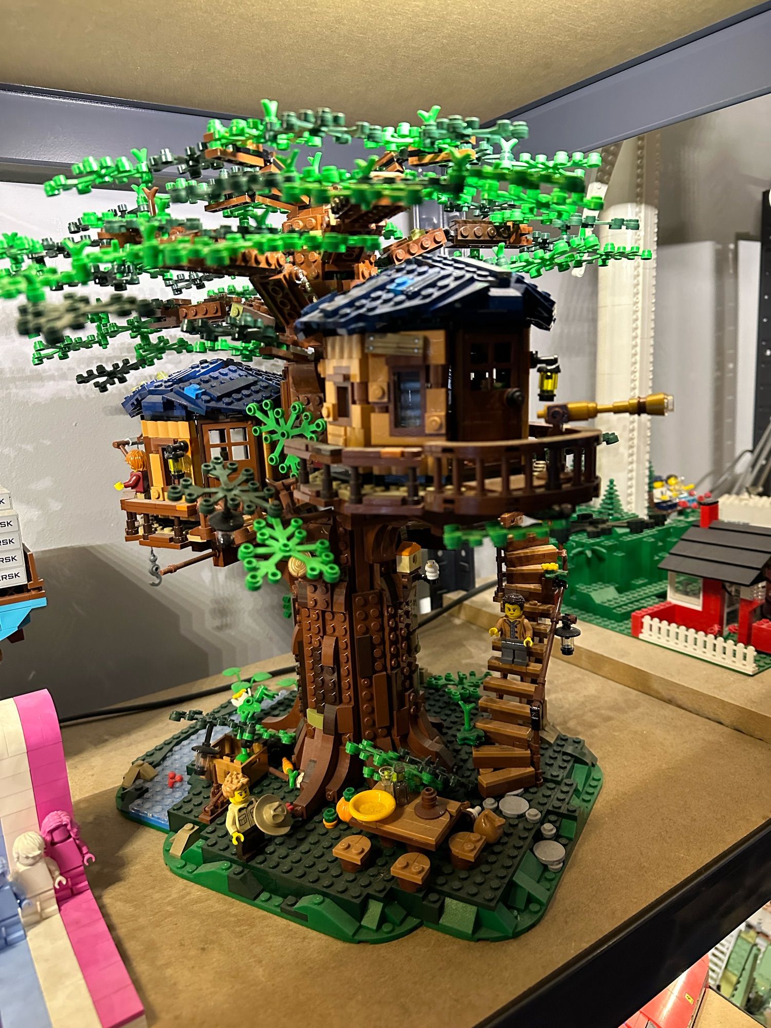 A Lego model of a tree with a treehouse.