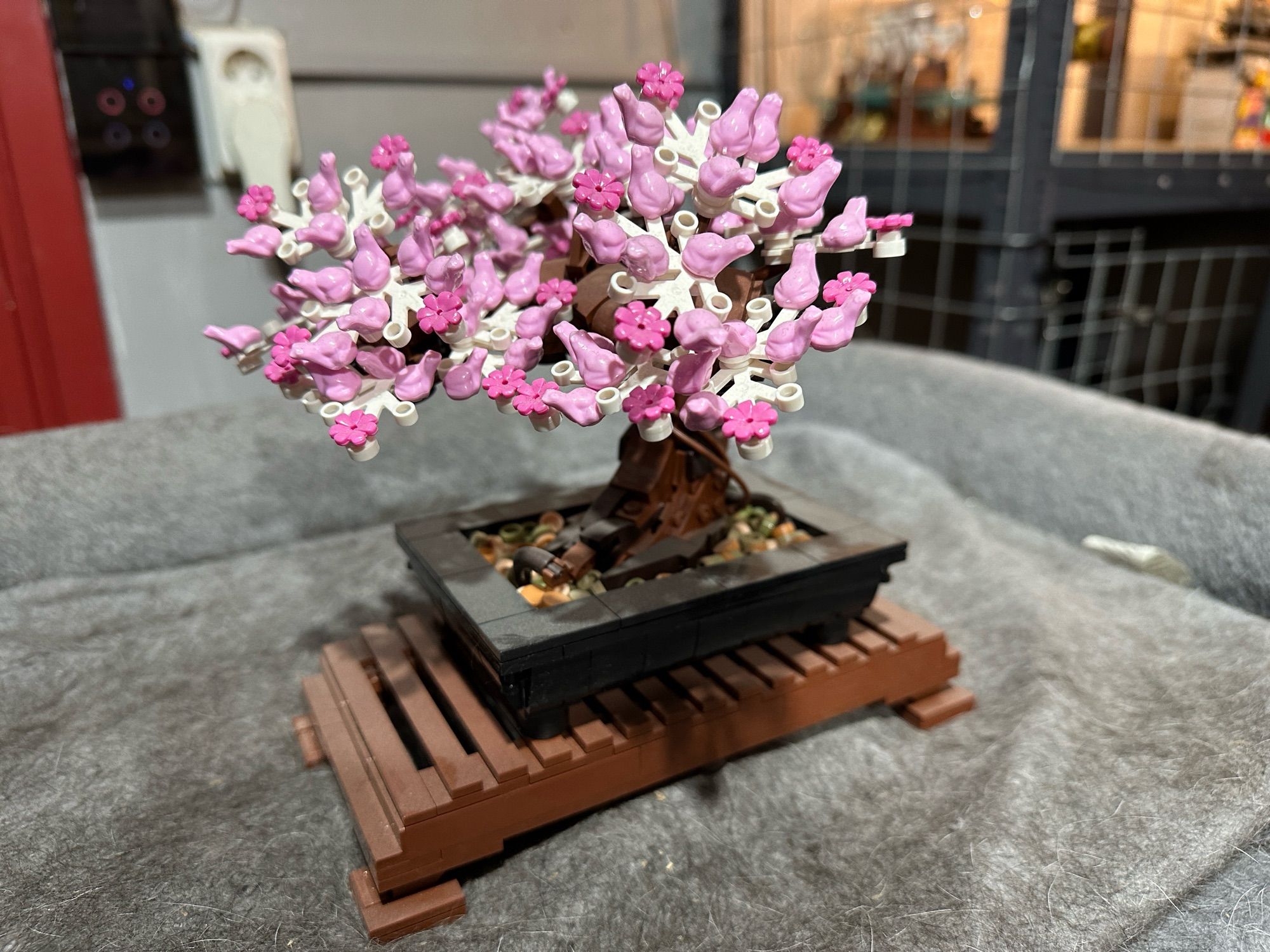 A Lego model of a bonsai tree in bloom.