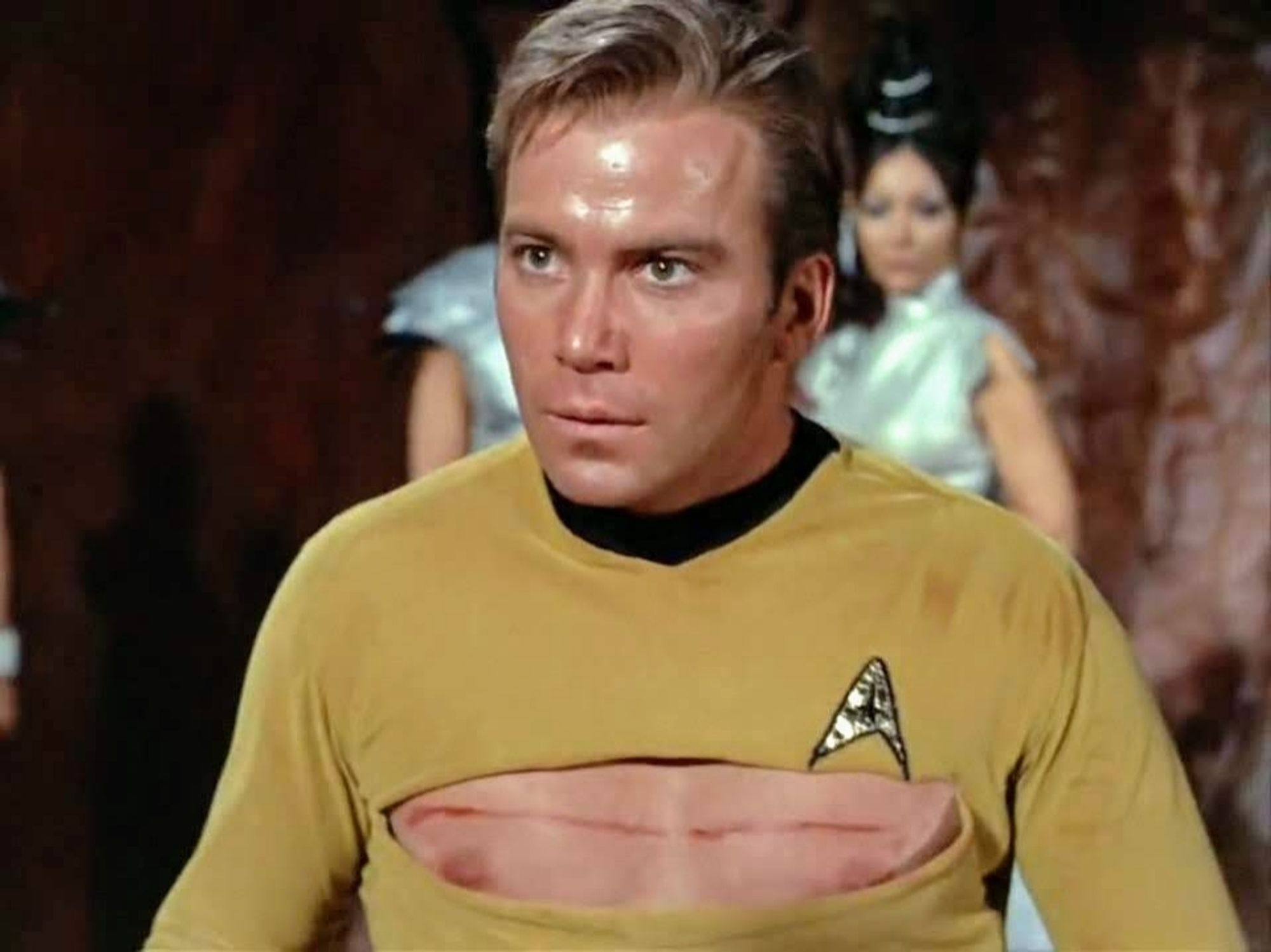 TOS scene. 
Kirk is standing outside with some ladies in silver getups behind him onlooking. Kirk looks shooketh and startled. He's #sweaty and his shirt is cut open acrossway nip to nip and it looks like someone just grazed him with a sword. No caption, just a boob window.