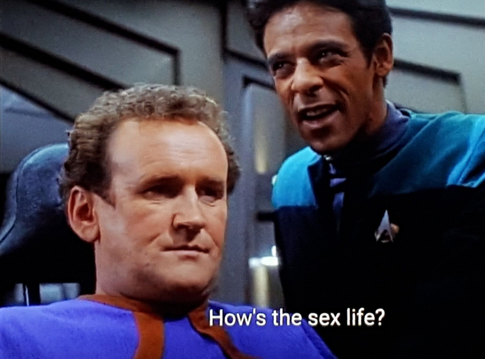 DS9 scene. We're in sick bay, I think, on DS9 station. Chief Miles Edward O'Brien, who Freddie Kruger has scary dreams about, is sitting in a chair with Dr Bashir standing over him talking excitedly. Chief Miles Edward O'Brien, who was once hired to narrate a biopic of Morgan Freeman's life, is staring blankly into the middle distance. Closed caption reads, "How's the sex life?"