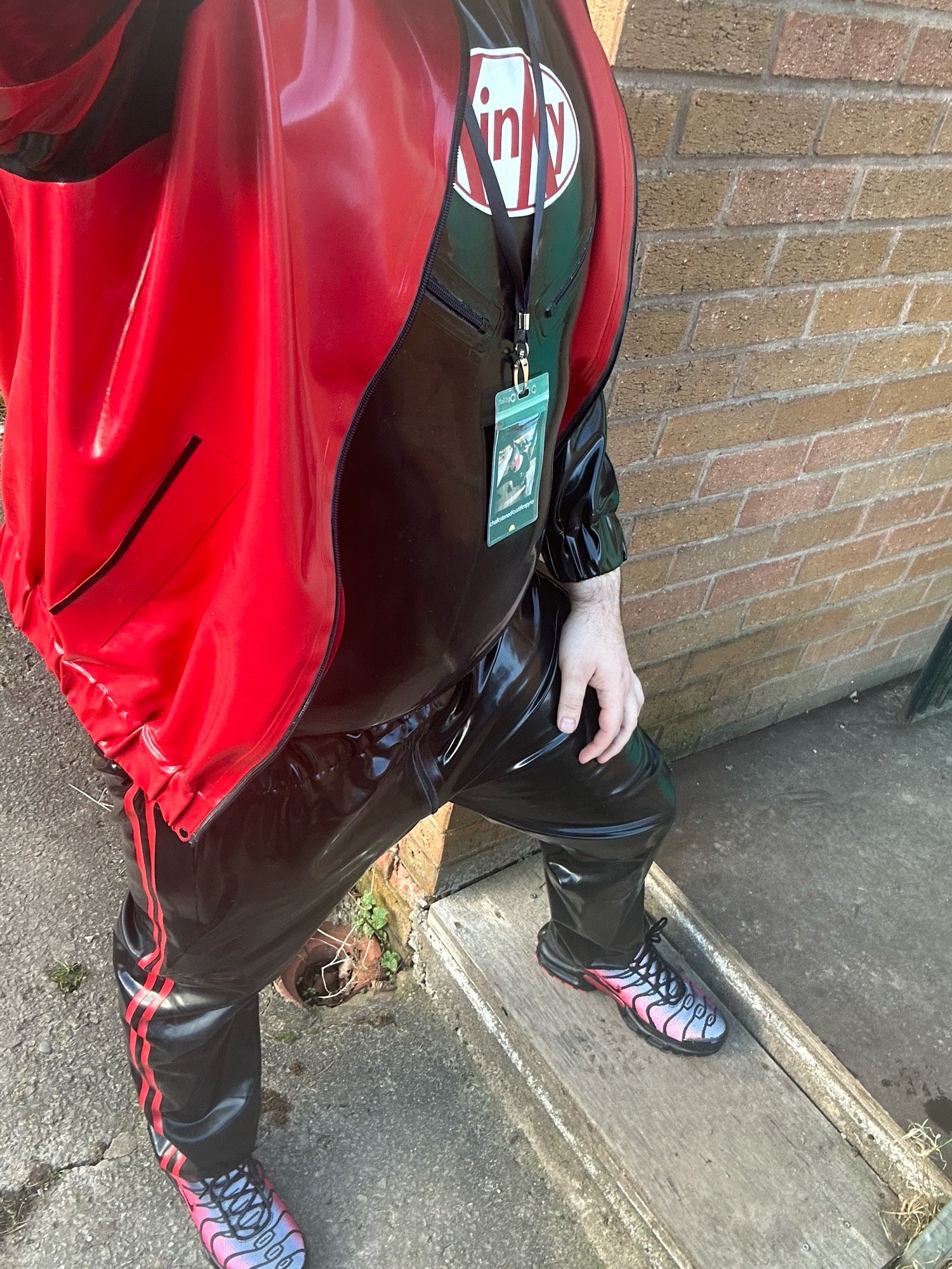 Invincible rubber tracksuit in red & black with KinKy t-shirt with nipple zips and red/silver Nike TNs