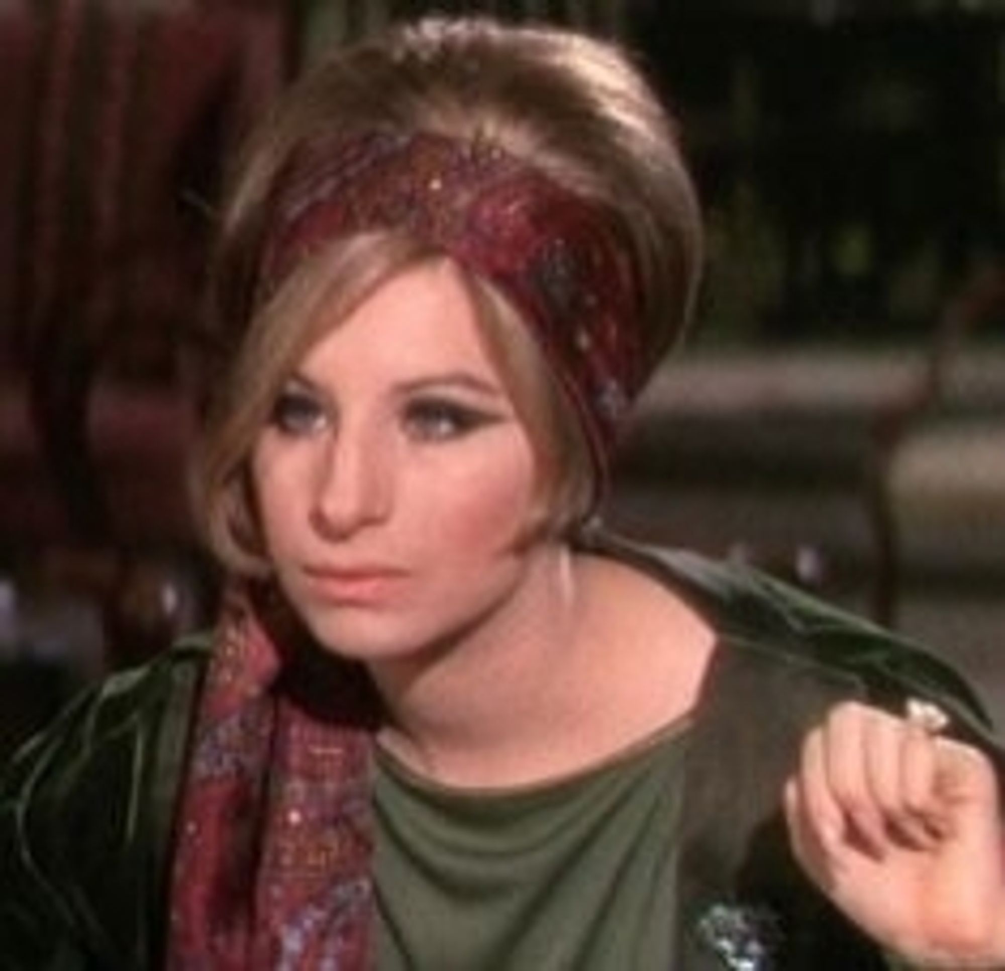 Barbra Streisand in Funny Girl with a big kinda beehive and a scarf