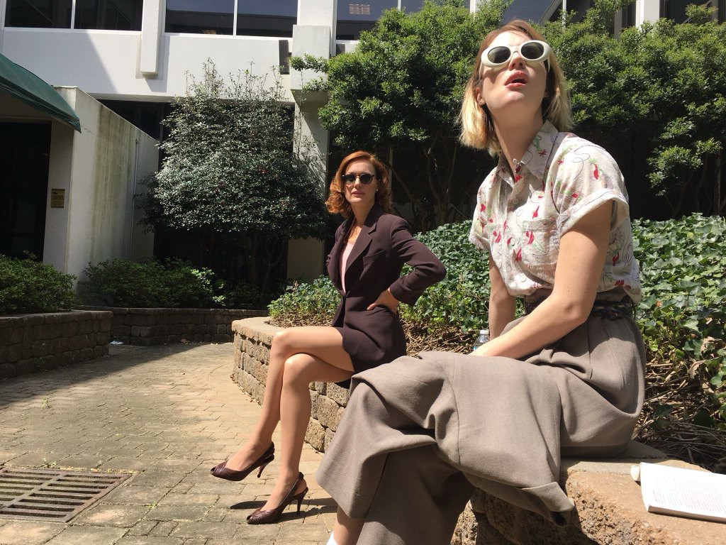 Kerry Bishe in costume as Donna and Mackenzie Davis in costume as Cameron Howe on the set of Halt and Catch Fire