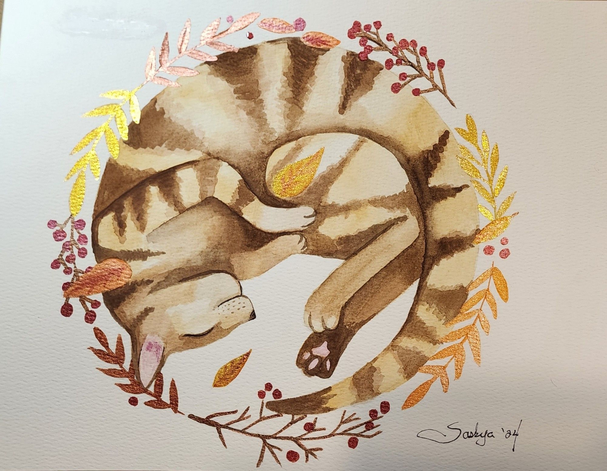 A watercolor painting of a cat stylized into a wreath, with leaves of autumn colors with red berries strewn throughout.