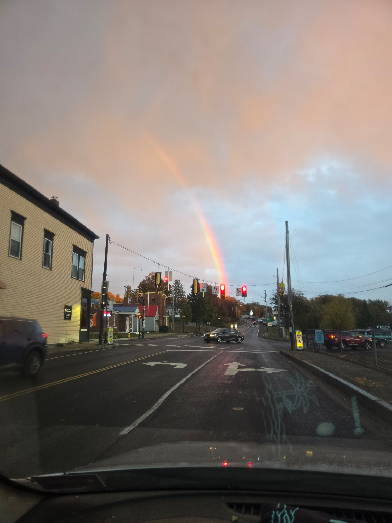 Super bright rainbow, taken next to the shithole restaurant (left) that invented Moxie, Lisbon Falls, ME