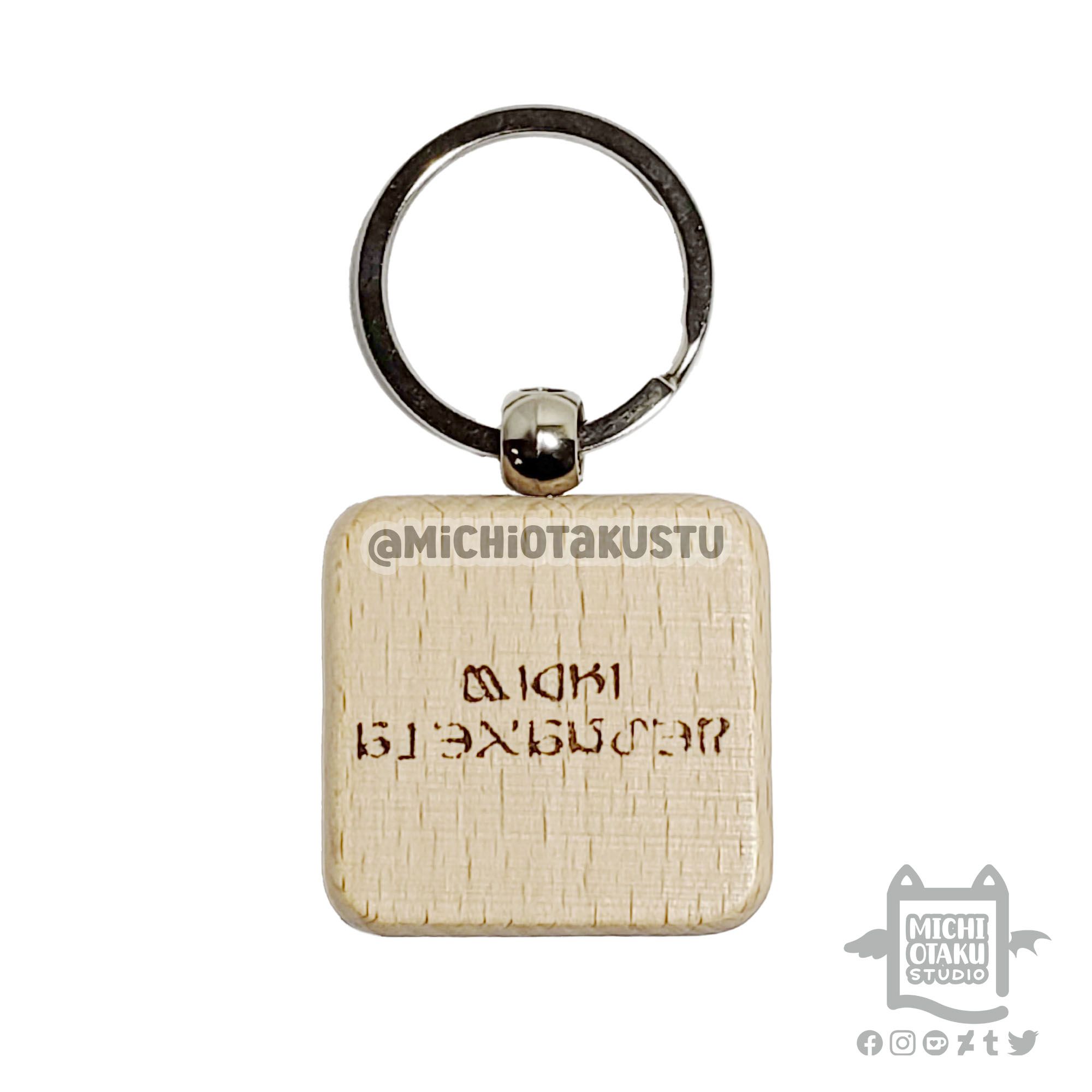 Custom engraved 4cmx4cm wood key tag of Final Fantasy XIV Online Eorzean text, "Michi Alexander".