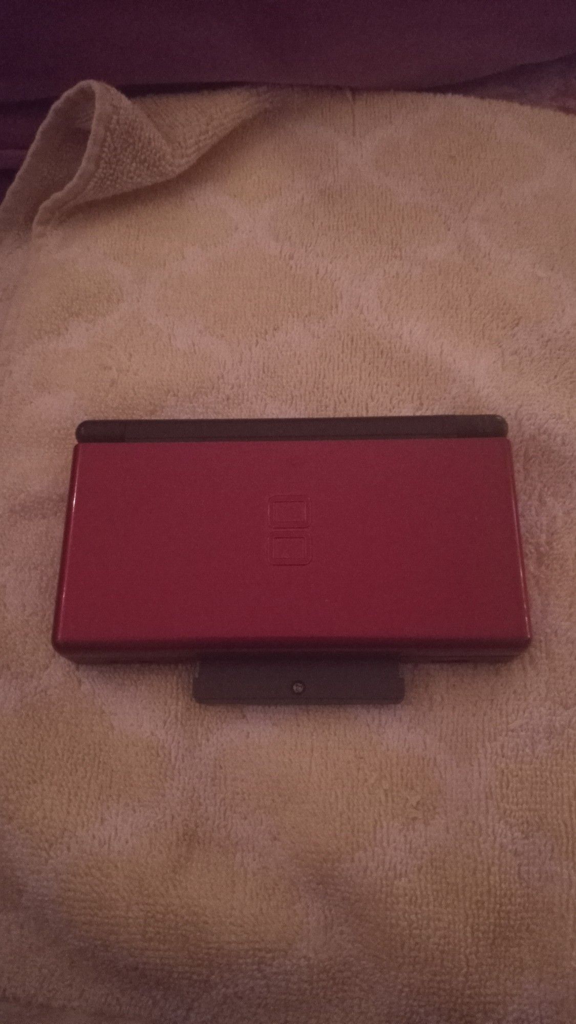 The front of the ds lite, it is crimson in color