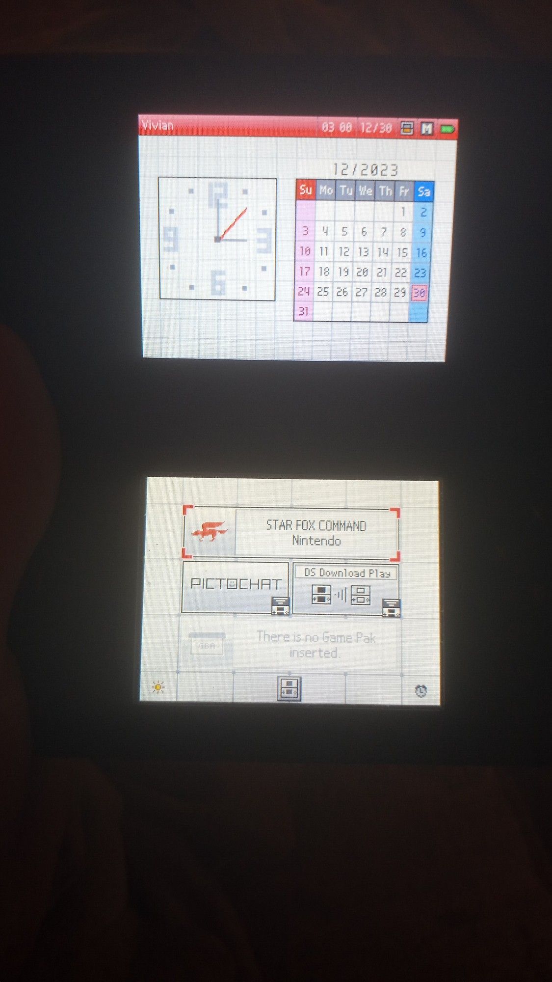 A ds lite home screen, the game in slot 1 (ds game slot) is star fox command, and slot 2 (game boy advace slot) is empty