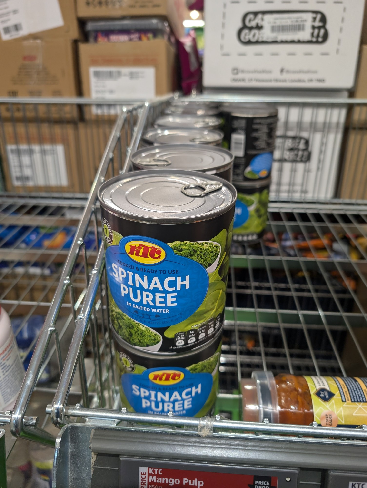 Tin cans of spinach puree 