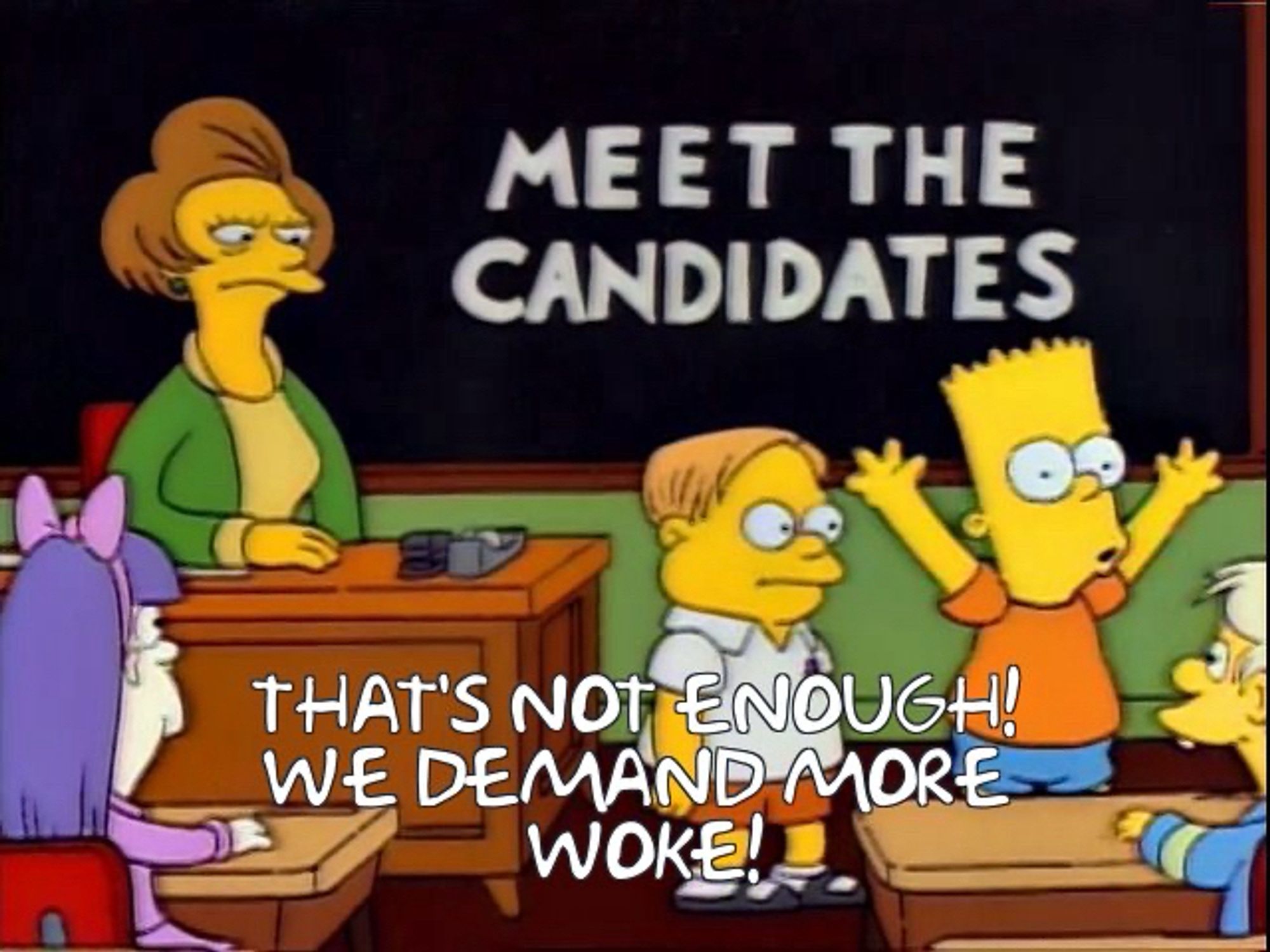 Bart and Martin standing at the front of the class while Ms. Krabappel looks on. Bart is shouting and has his arms raised.

Caption reads “That’s not enough! We demand more woke!”