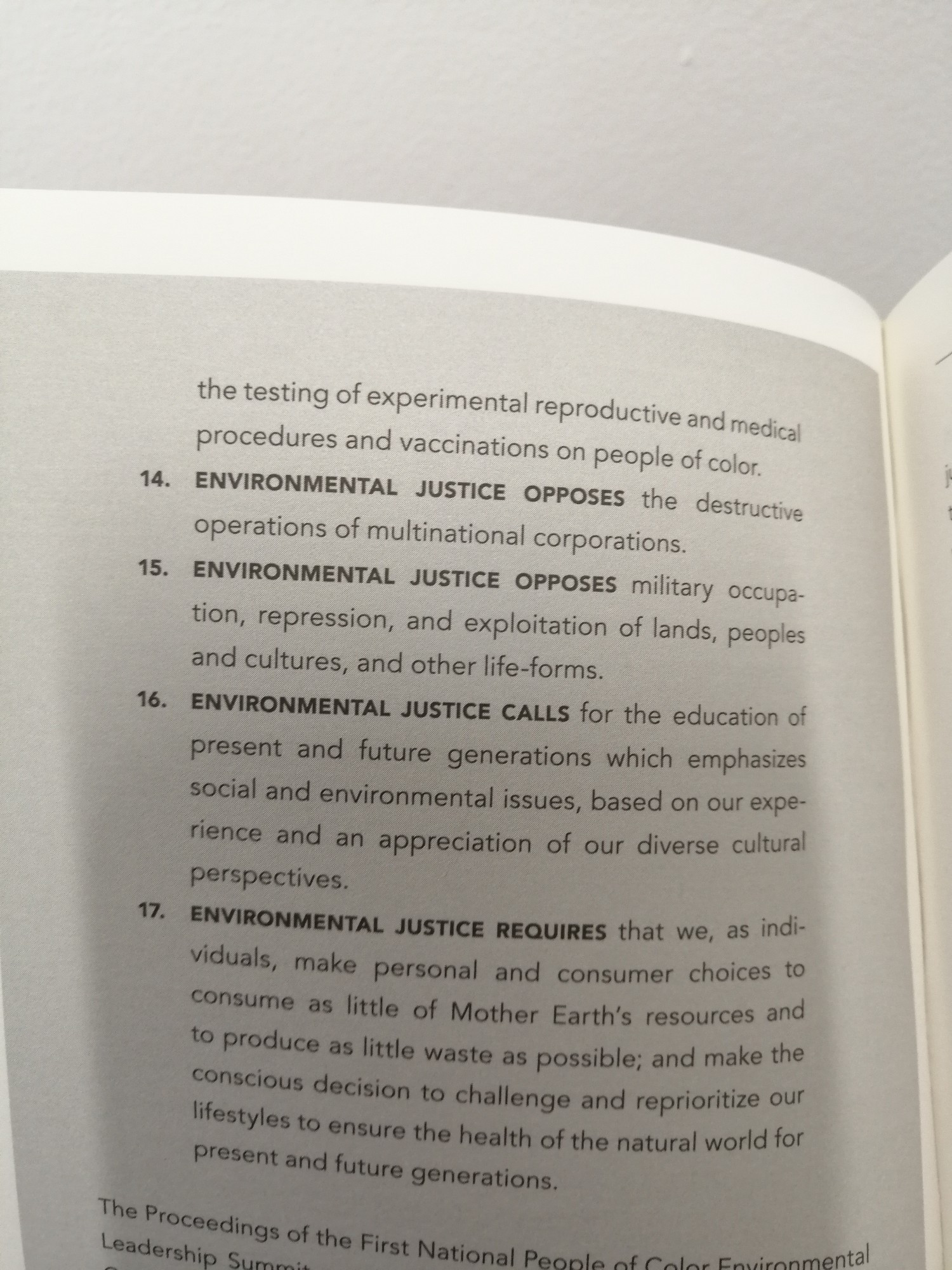 A page from the book Intersectional Environmentalist: How to dismantle systems of oppression to protect people+planet by Leah Thomas

Here is a quote from the principals of environmental justice defined at the first national people of color environmental summit.

14. Environmental justice opposes the destructive operations of multinational corporations.
15. Environmental justice opposes military occupation, repression, exploitation of lands, people and cultures, and other life forms. 