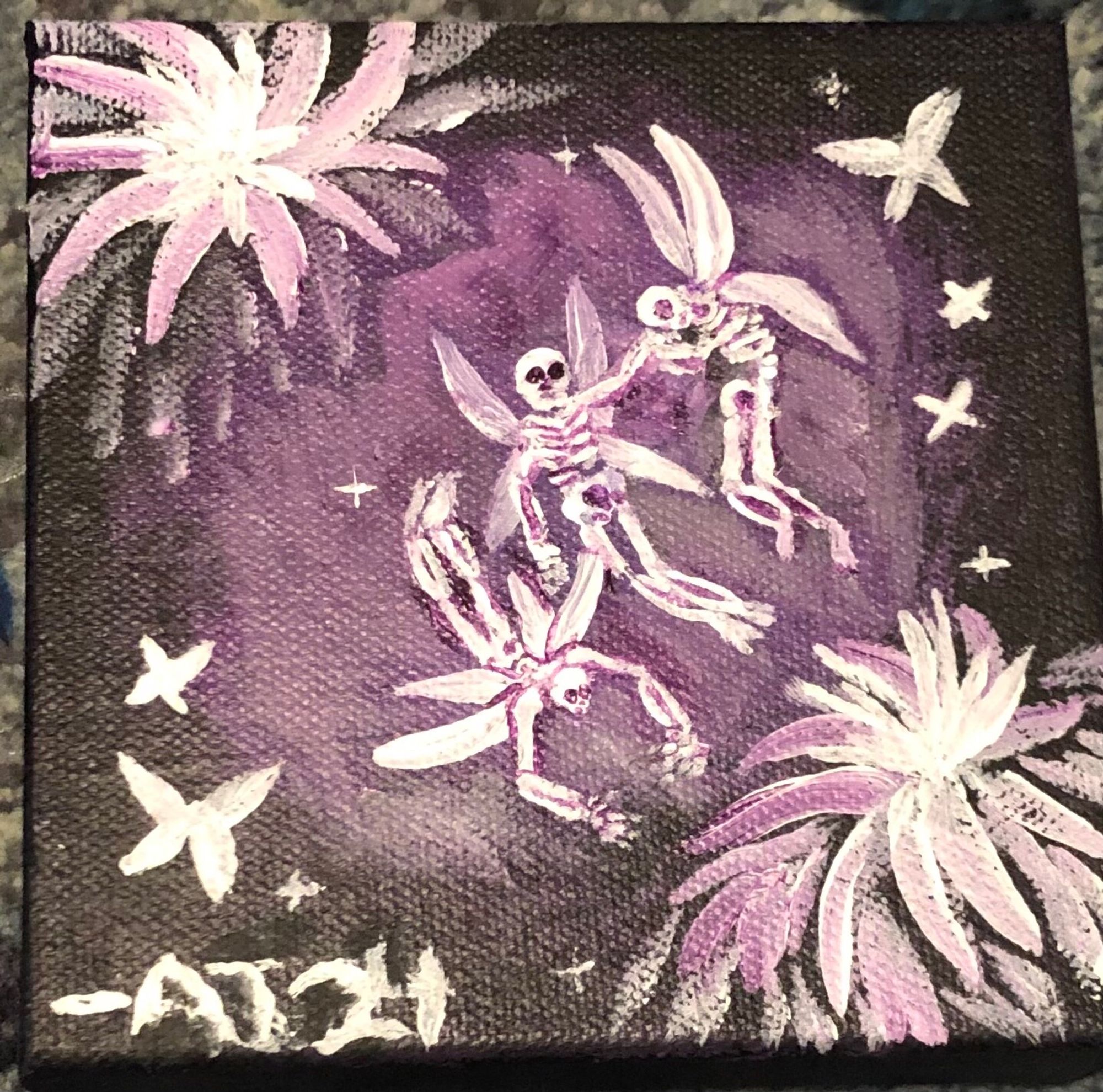 Three skeletal fairies flit about amongst purple flowers