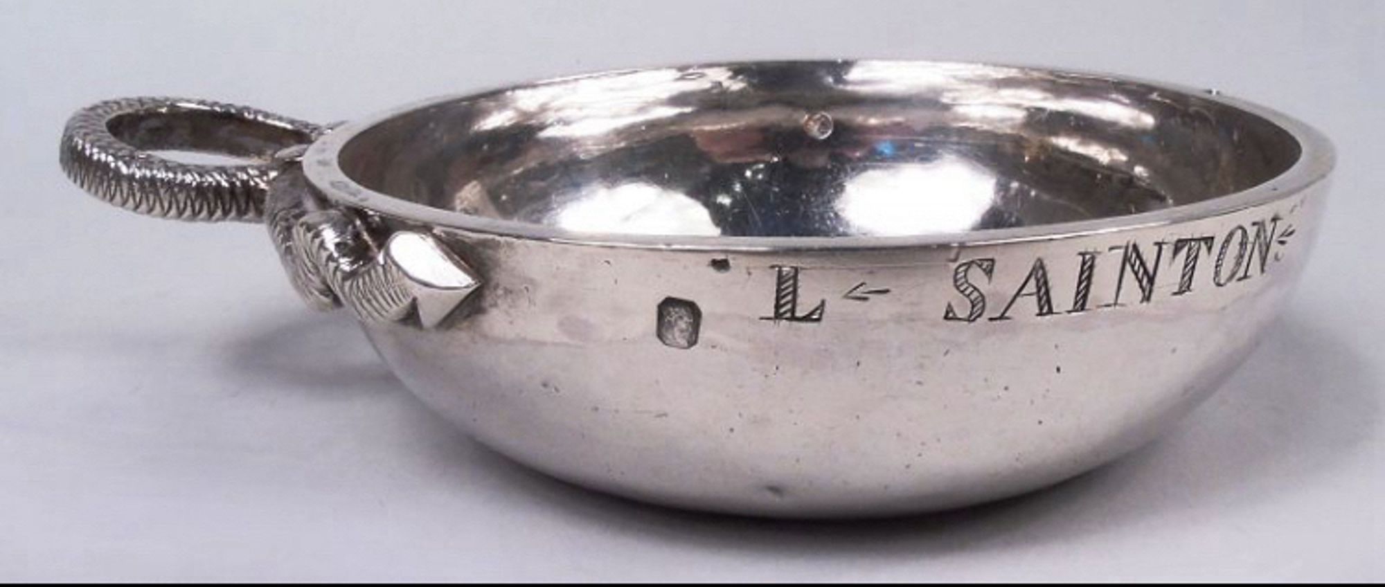 Silver tastevin with engraved owner's name (L SAINTON) & typical snake handle (Paris, c1820)