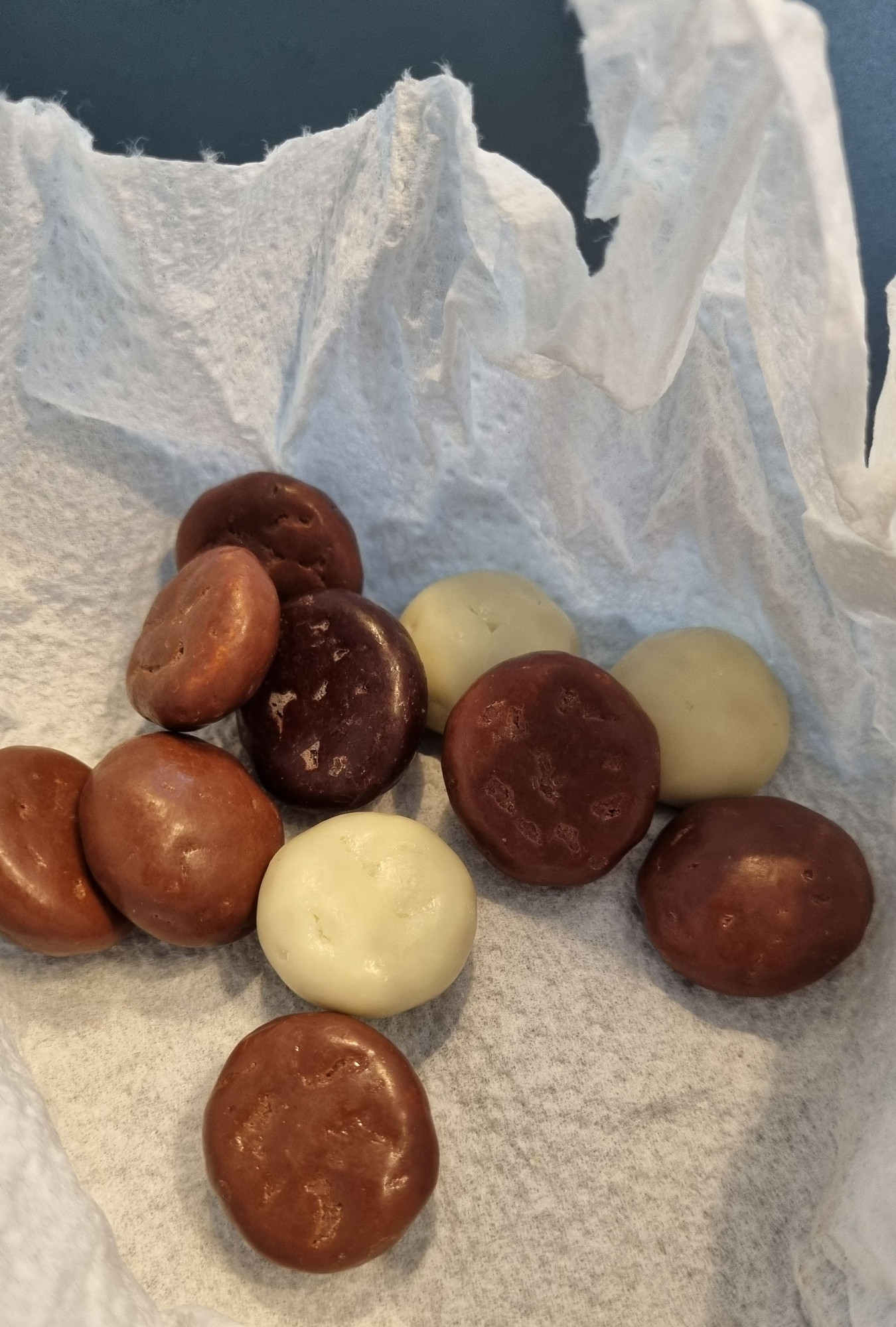 Chocolate-covered kruidnoten on a napkin