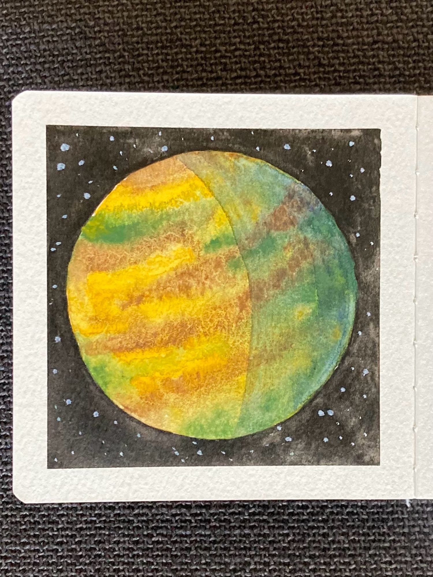 A watercolor painting of a planet in space. Its surface has swirling bands of brown, green, and yellow. The right side of the planet is in shadow. In the background is the inky black of outer space, punctuated by small stars.