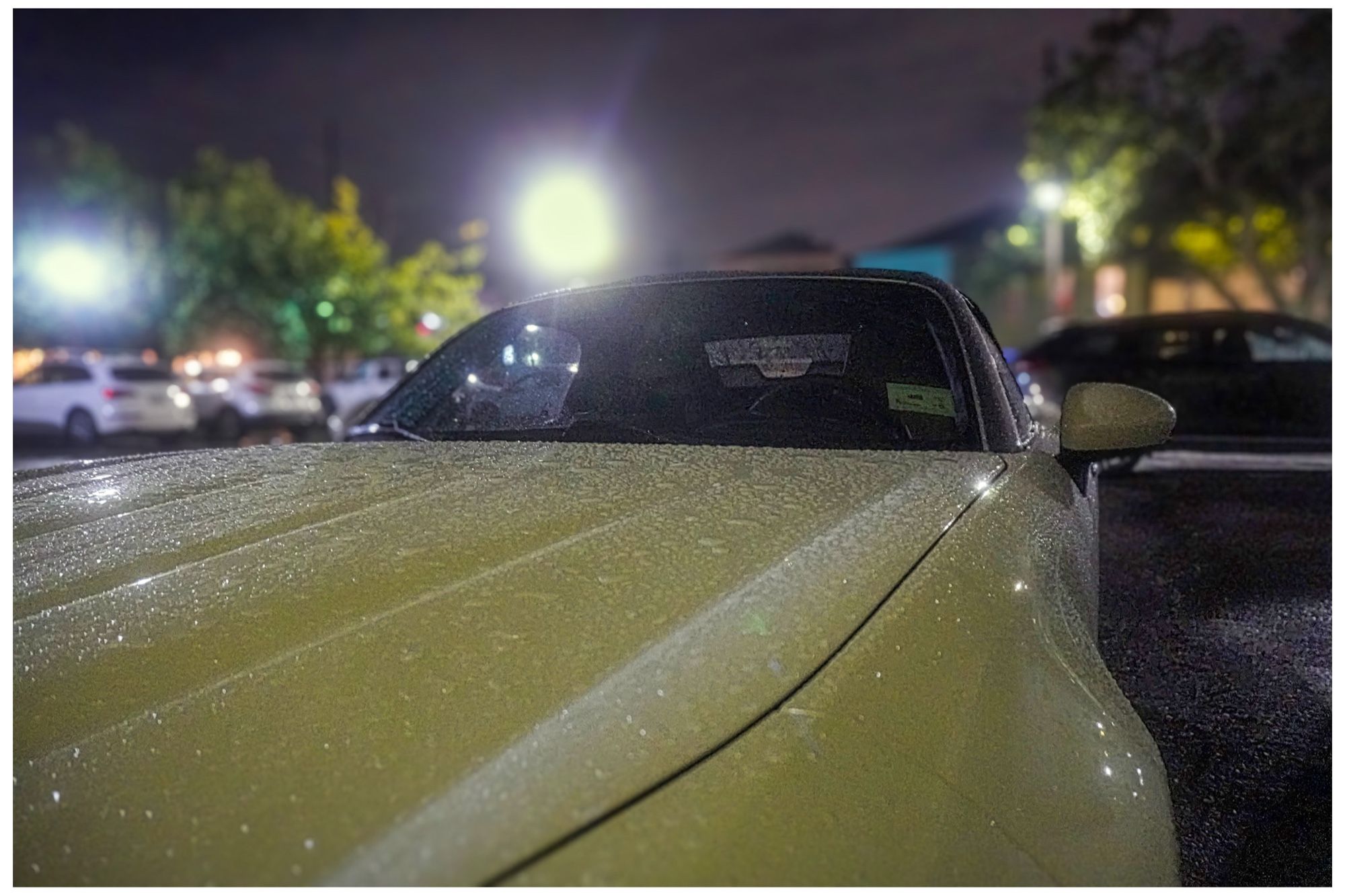 Fiat 124 Spider on a rainy evening.