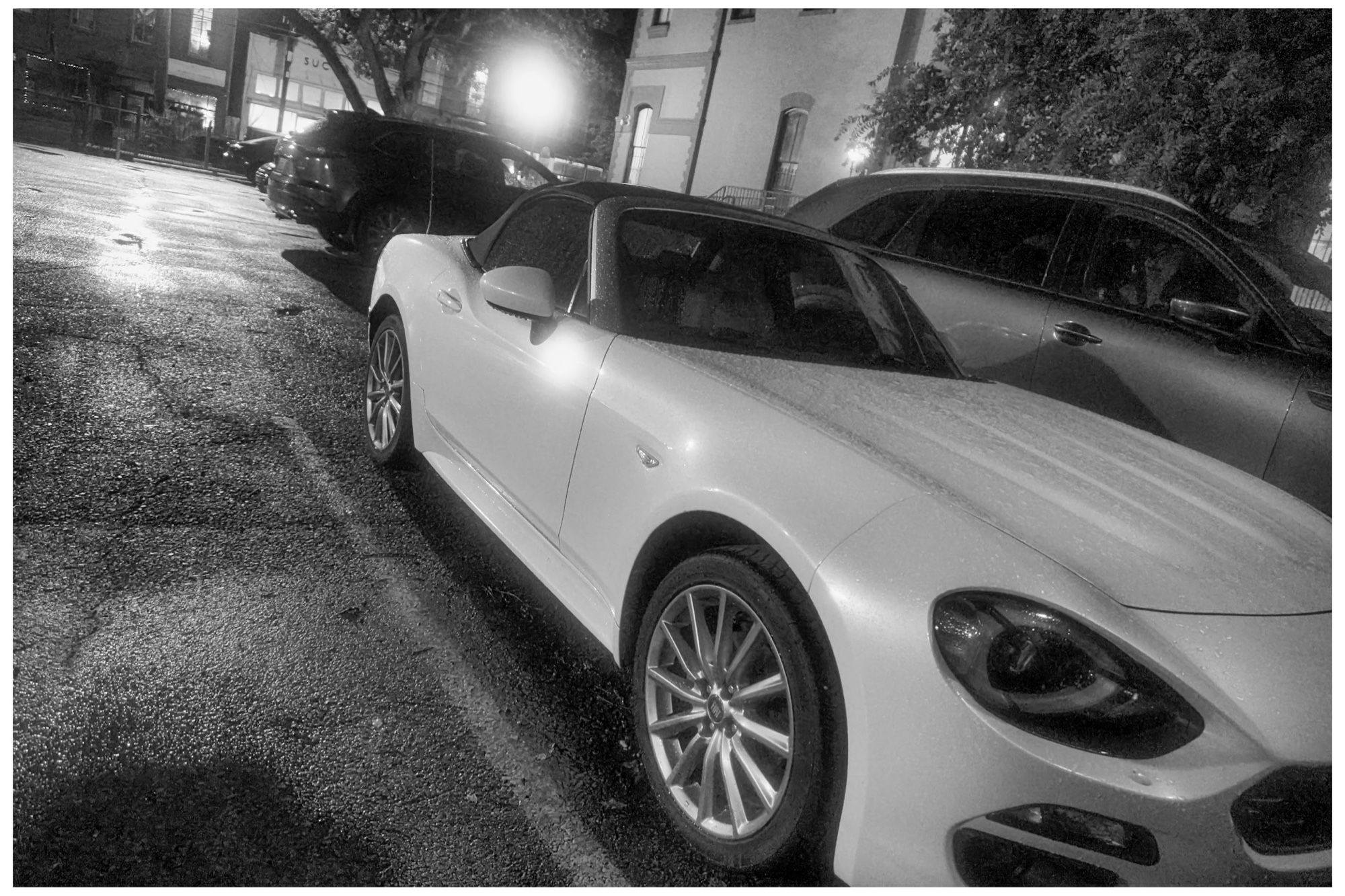 Fiat 124 Spider on a rainy evening.