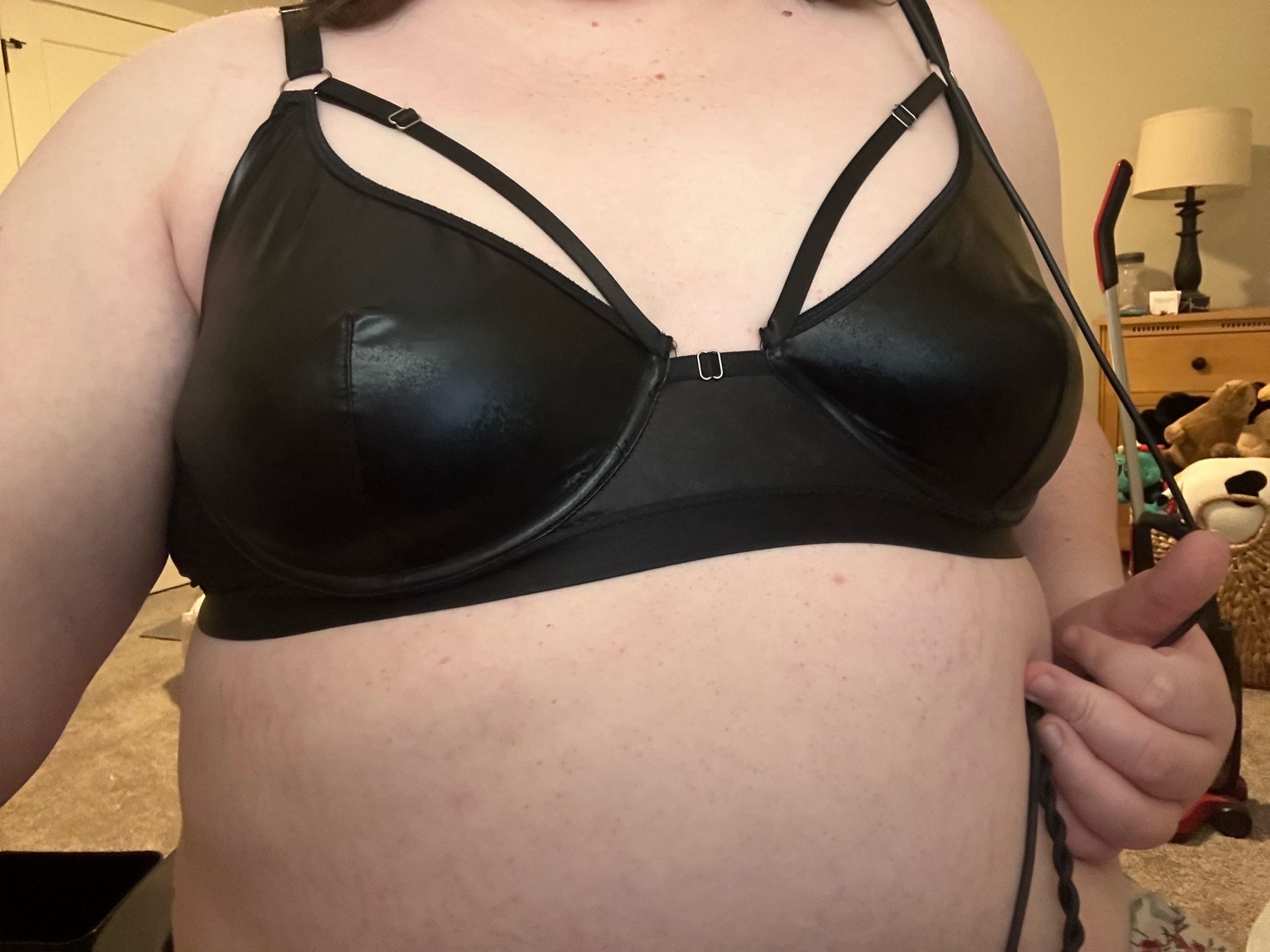 Amelia in a black leather lingerie bra