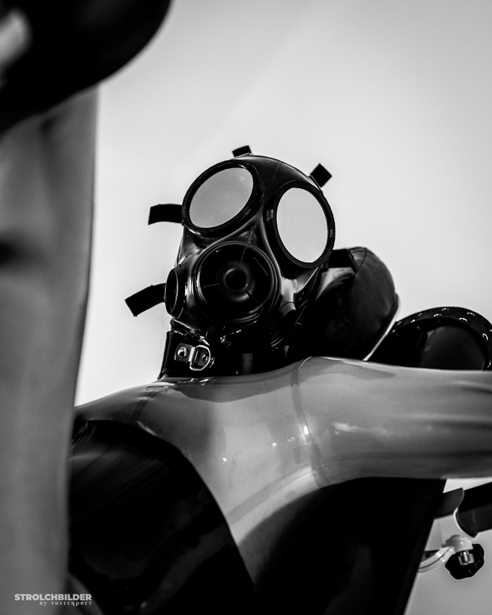 Latex encased person with Avon FM12 gas mask.