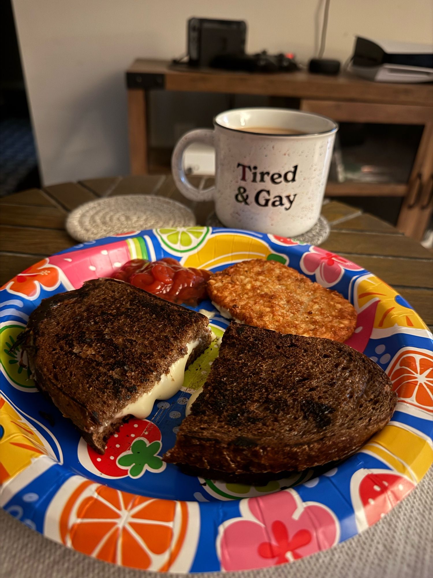 Grilled cheese on pumpernickel 
A Trader Joe’s hash brown
And coffee in a mug that says tired & gay