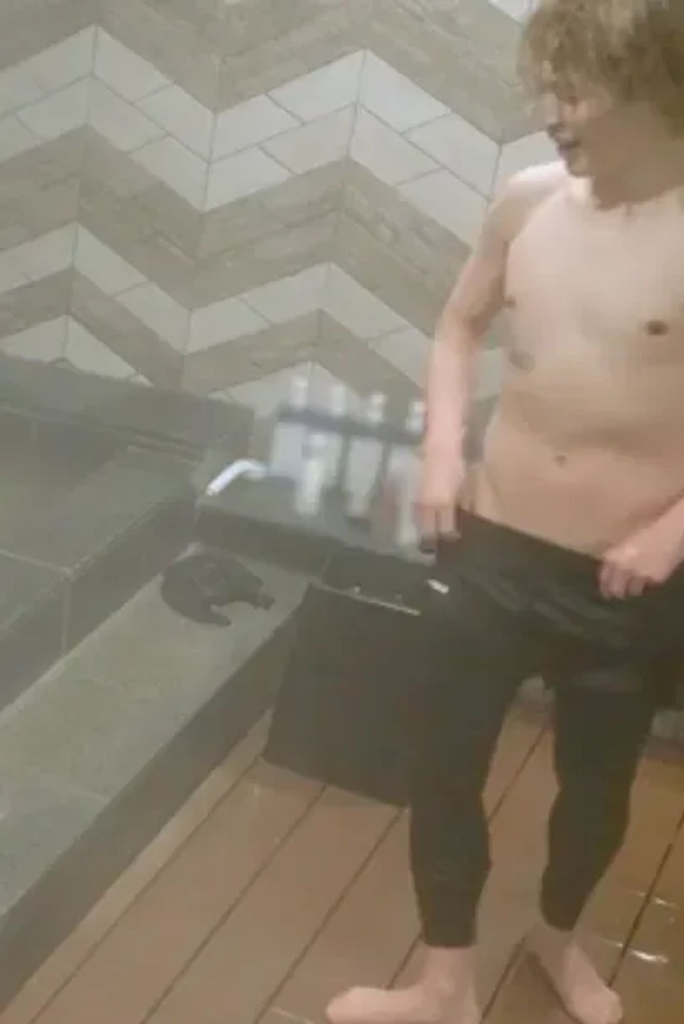 A screenshot of Jimin from Are You Sure?! episode 6. Shirtless, wet Jimin wearing only skin tight black pants and shorts that he is tugging down very dangerously low and revealing an extremely delicious v-line. Nothing but wet, smooth skin that you cannot help but imagine how it would feel beneath your hands...admin is gonna stop cause the thoughts are NOT sfw right now.