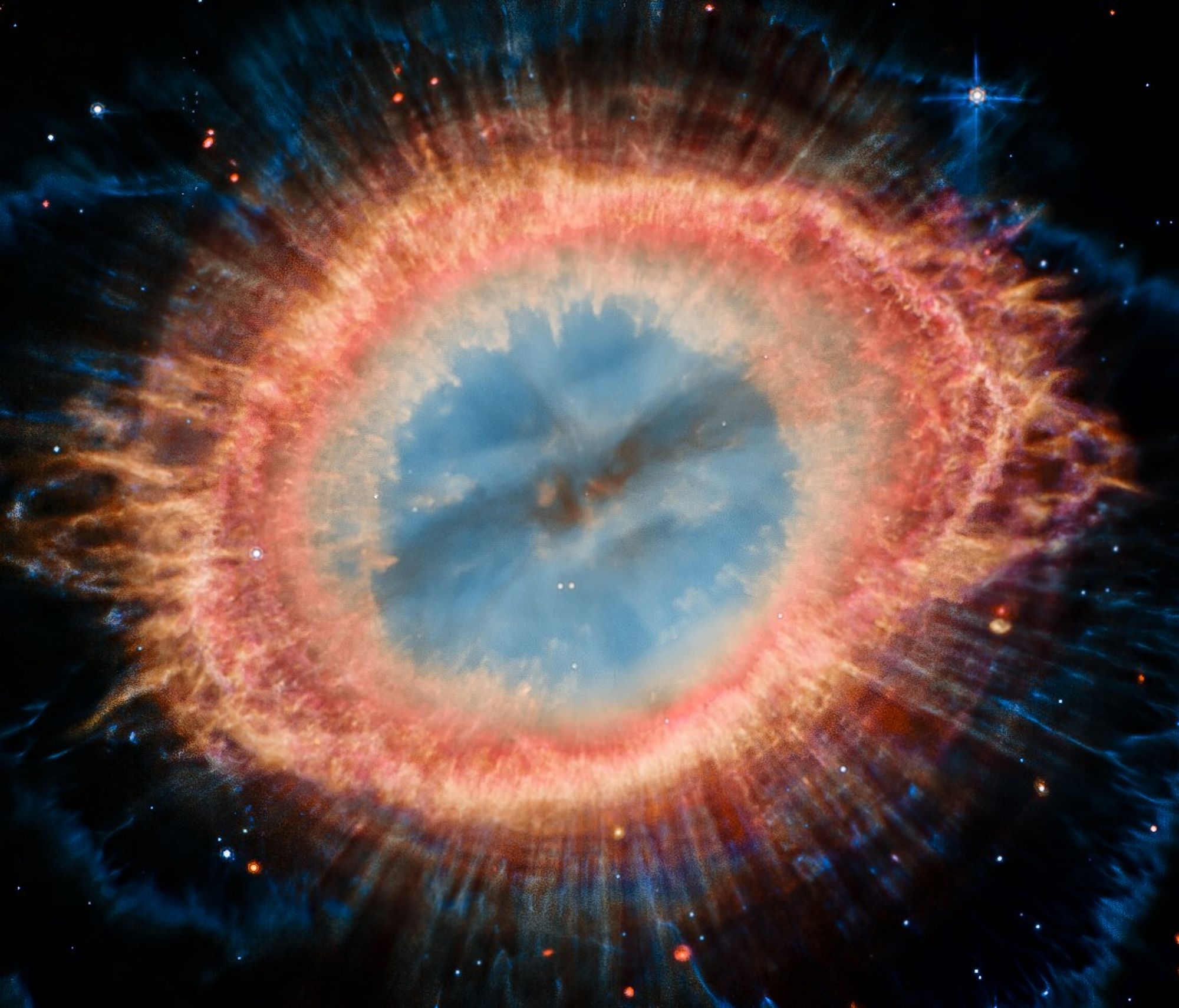 The Ring Nebula, also known as Messier 57 (M57), is a planetary nebula located in the constellation Lyra. It's a popular target for amateur astronomers due to its distinctive ring-like shape. The image you provided, captured by the James Webb Space Telescope's Mid-Infrared Instrument (MIRI), offers a unique perspective by highlighting the nebula's intricate details and composition in the infrared spectrum.