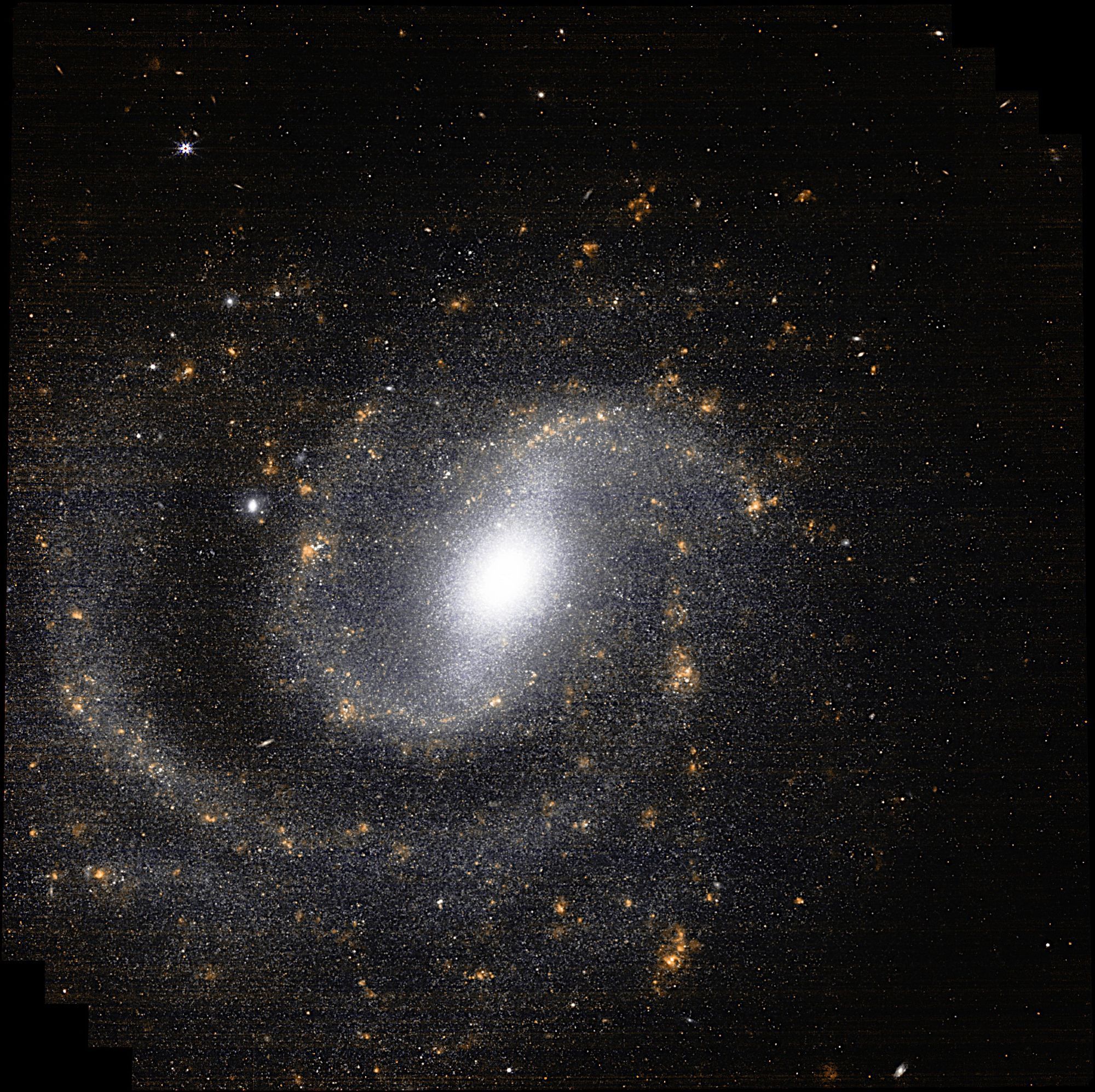 A detailed, infrared image of a spiral galaxy, NGC 1637, showcasing its bright core, swirling arms, and numerous bright stars. The image was captured by the Near-Infrared Camera (NIRCam) aboard the James Webb Space Telescope.