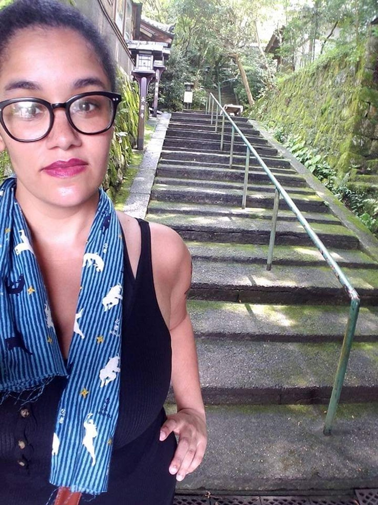 Sweaty me standing in front of stone stairs with my tenugui towel around my neck