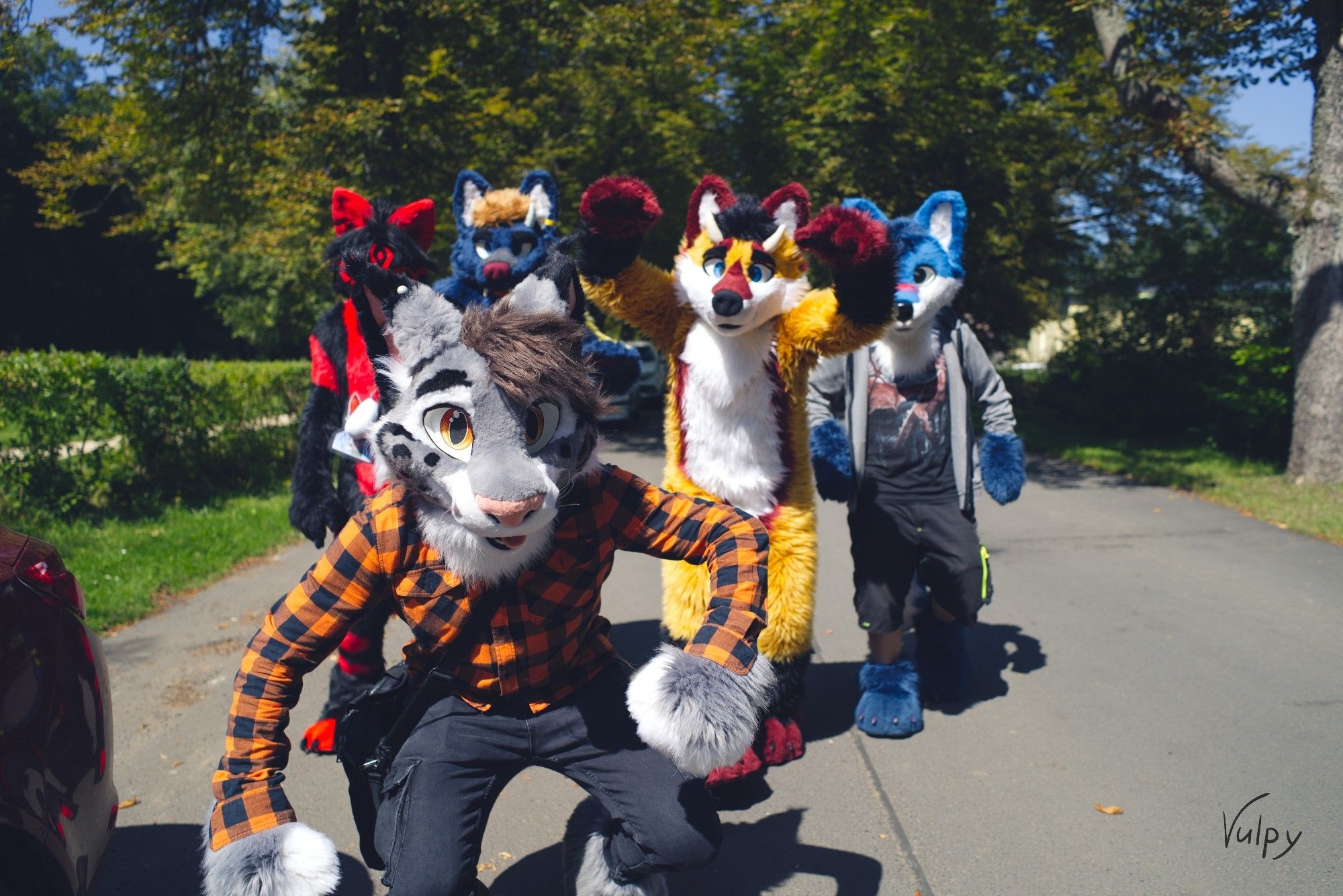 A picture of a group of Fursuiters walking with exaggerated poses, the type of which were once common on 90s Rap Album covers.