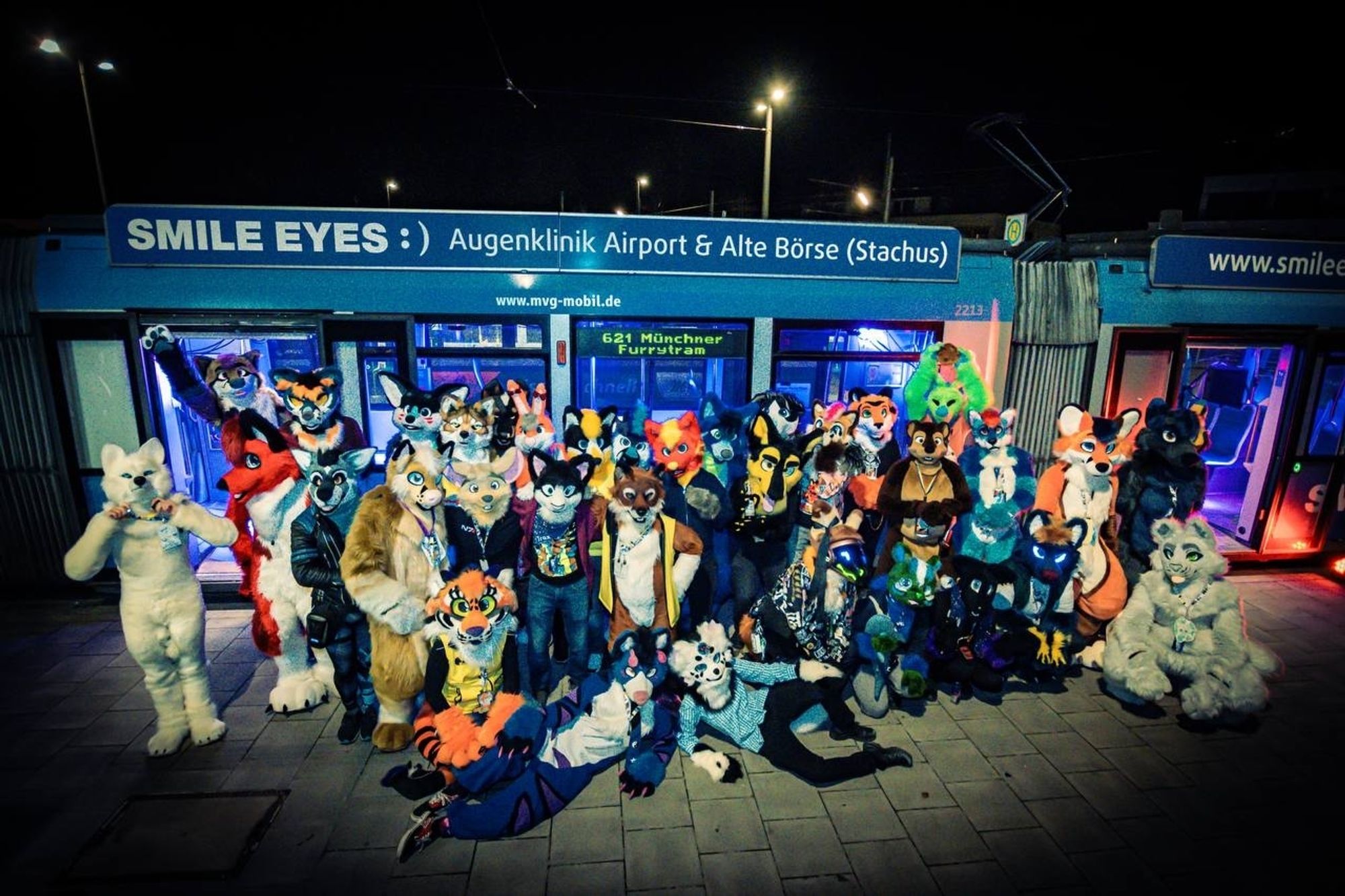 The official Fursuiter group photo of the "Munich Furrytram"

About 30 Fursuiters stranding and sitting next to a standing tram.