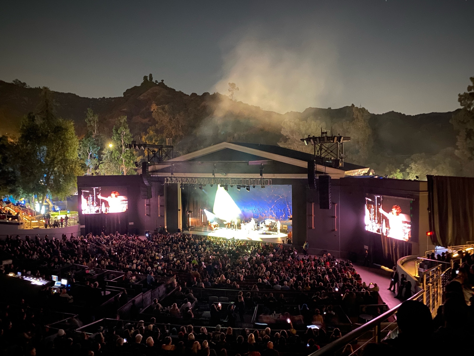 A full crowd at the Greek Theatre with PJ Harvey performing at night.