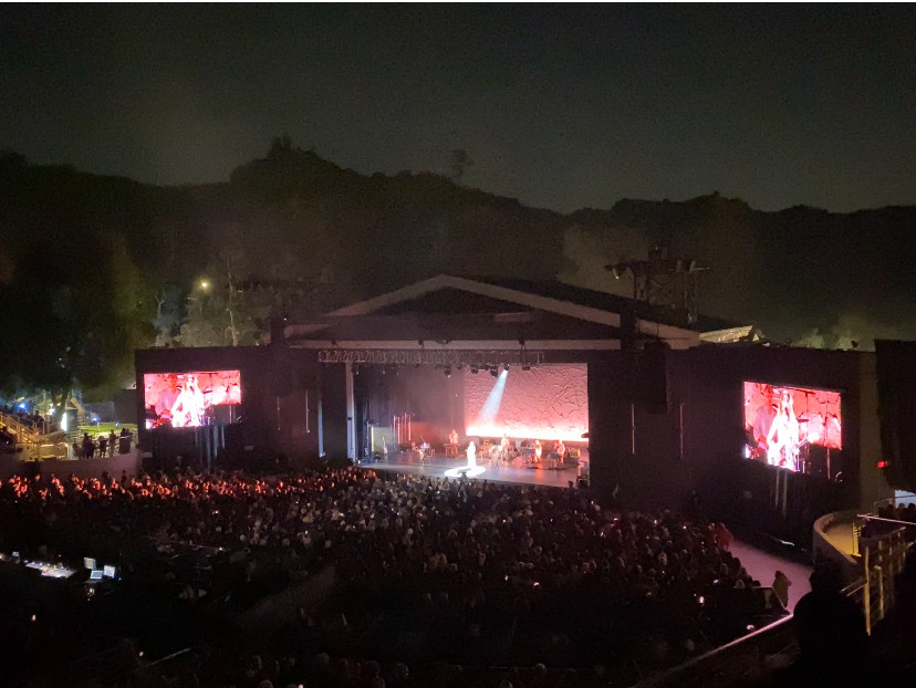 A full crowd at the Greek Theatre with PJ Harvey performing at night. 