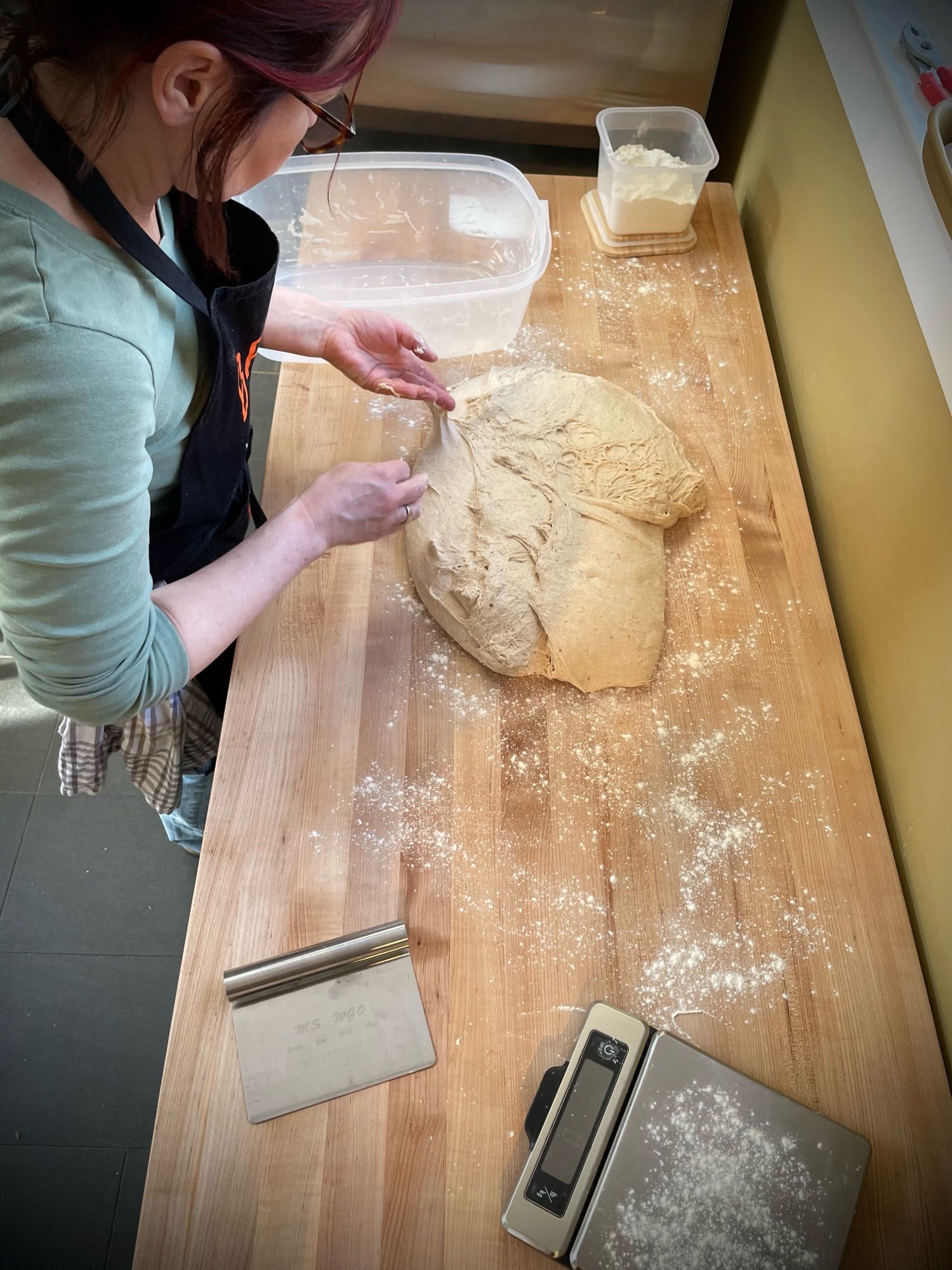 A tub of sourdough is ready for shaping.