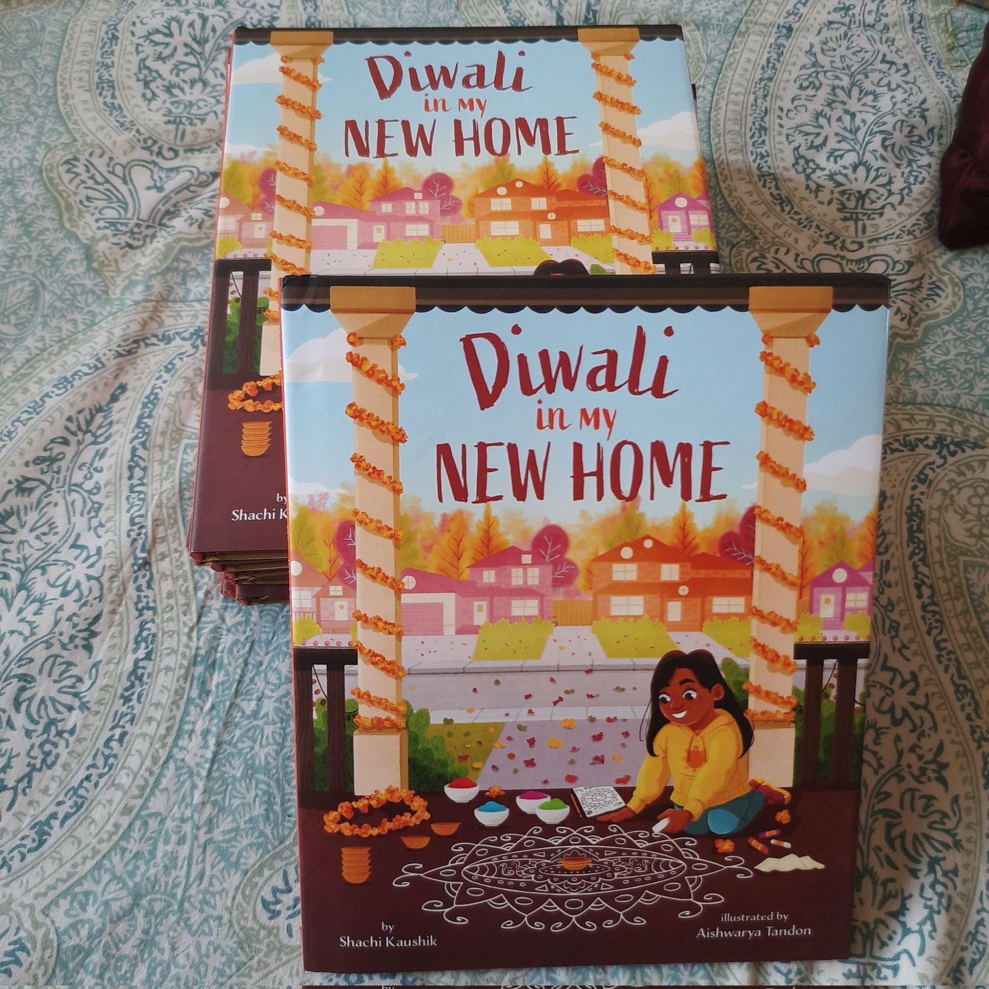 A stack of copies of DIWALI IN MY NEW HOME.