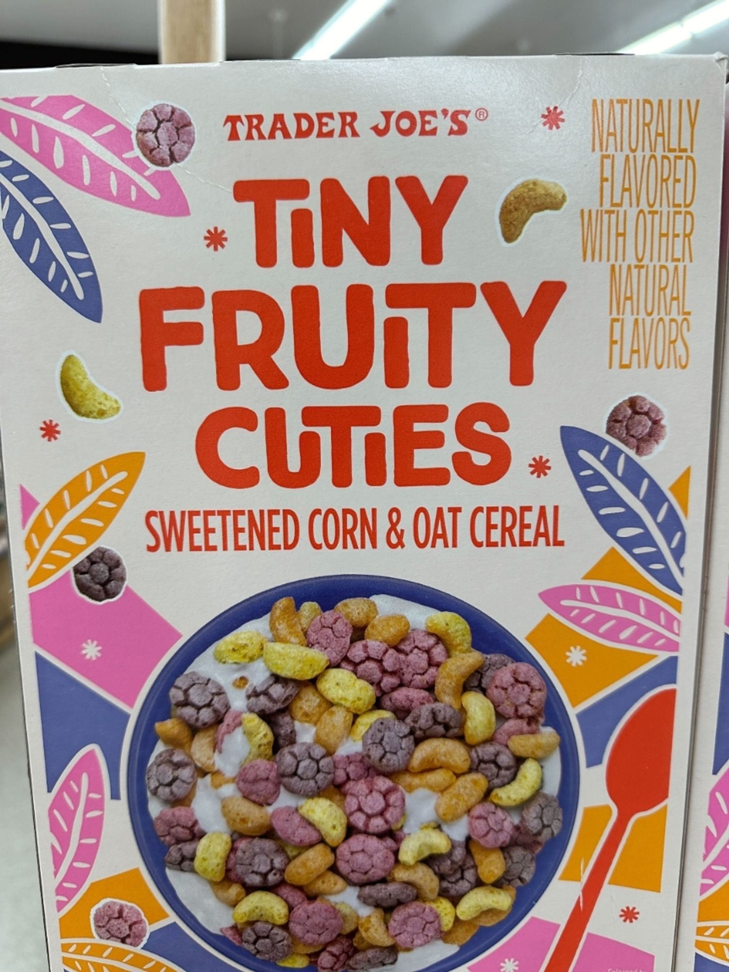 cereal box of "tiny fruity cuties" sweetened corn and oat cereal by TJs