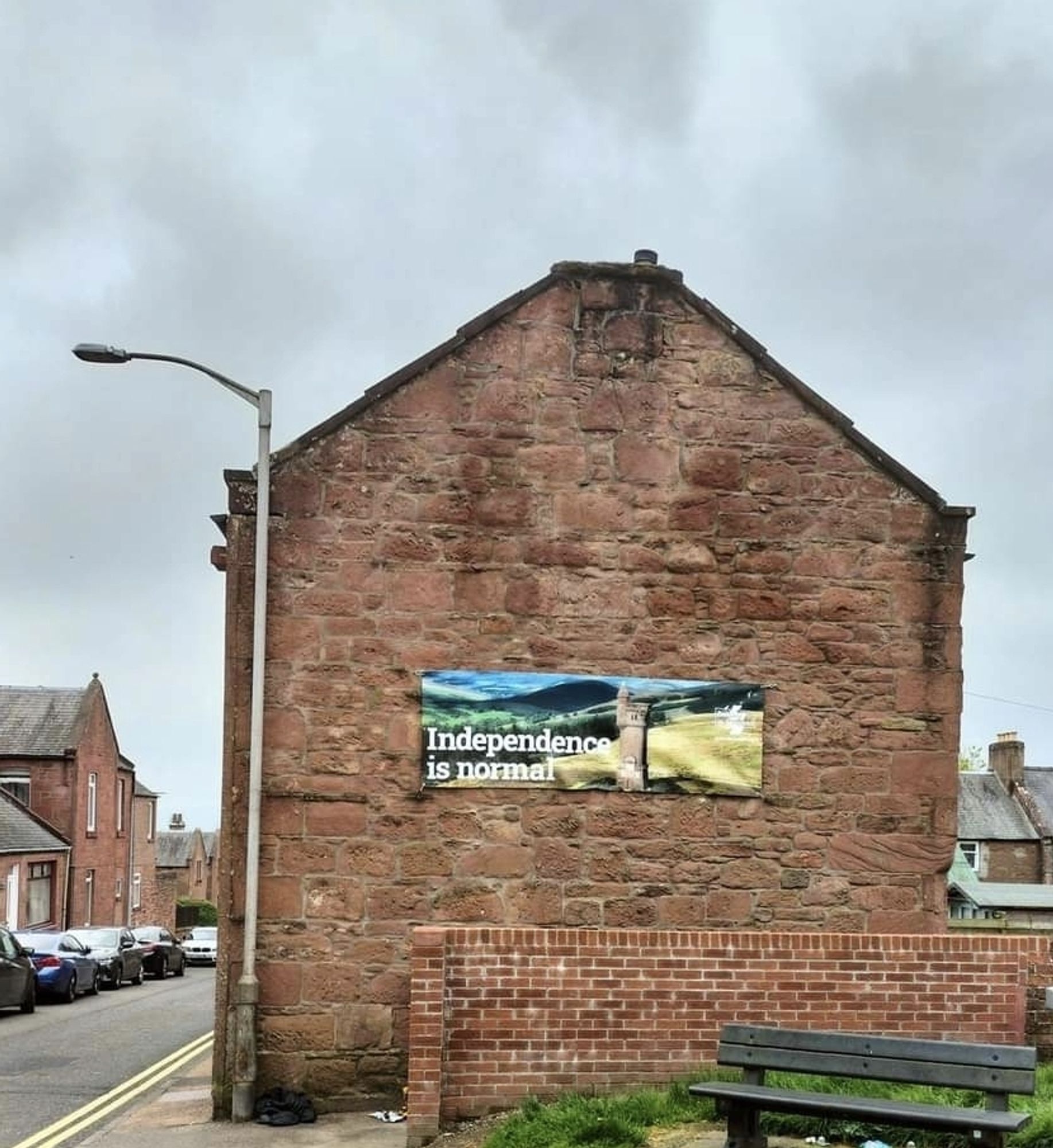 An 'independence is normal- banner on a gable end