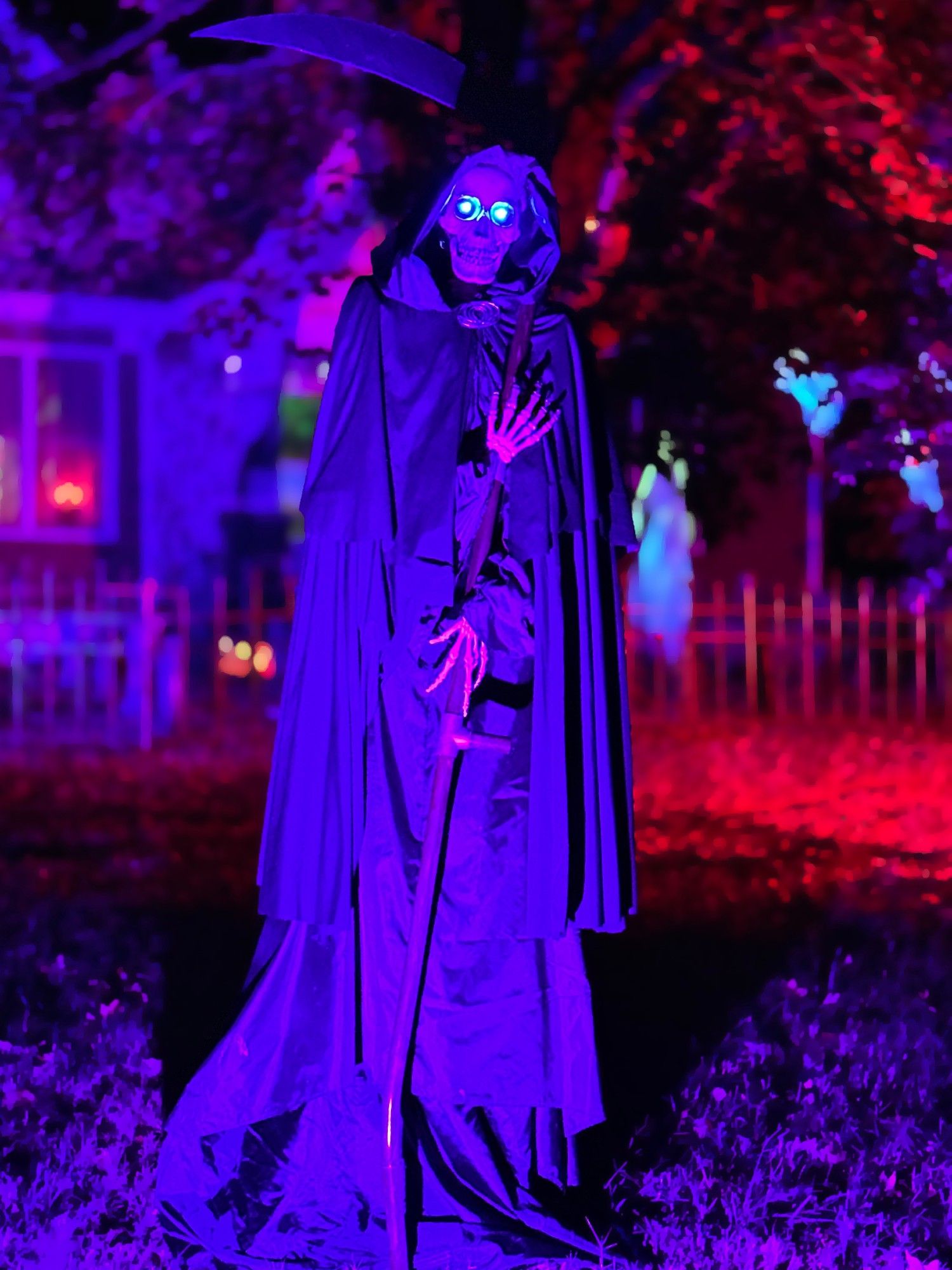 A 7 foot tall prop of Death from Discworld with colored lighting.