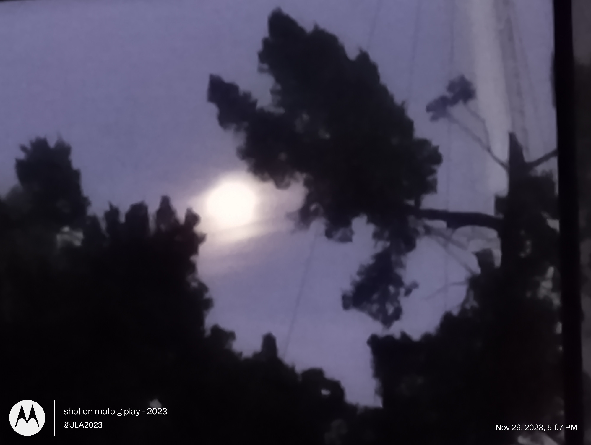 The Moon with a halo in front of some clouds in San Pedro, California, USA. Image ©JohnSheaallrightsreserved.