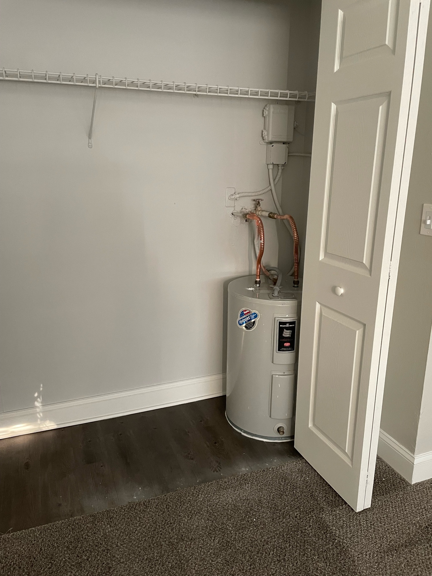 One bedroom closet holds the apartment’s hot water heater. This is standard for a lot of places in Florida as I guess they couldn’t be bothered to sort out any other spot considering we didn’t have furnaces to pair them with? Dunno. (Ignore the baking soda dusted on the carpet & floor. Will vacuum that up tonight after work. I was trying to solve the issue of a terrible smell coming from that area but read this morning how to fix that.) Anyway, see next image please.