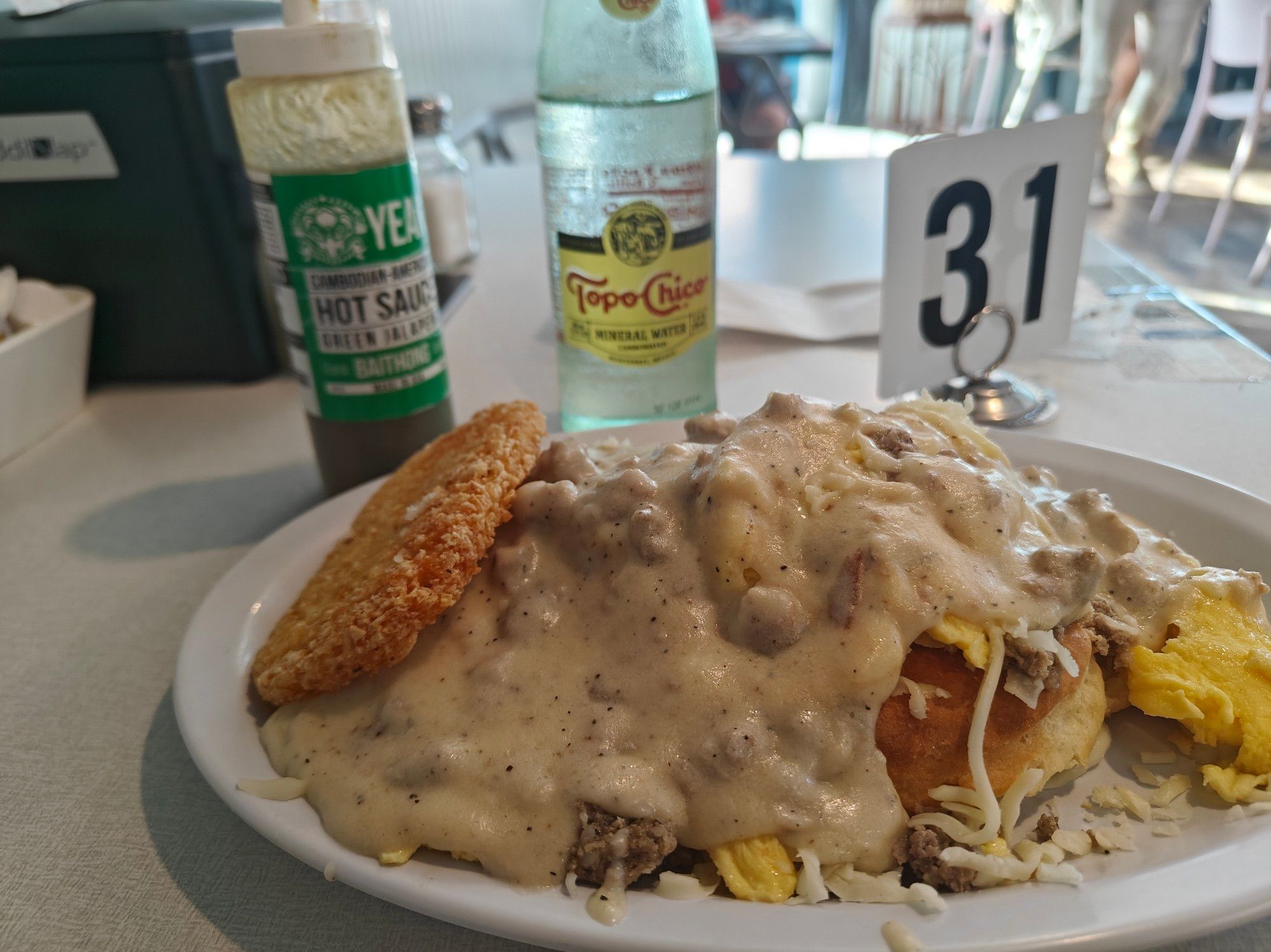 Biscuits and gravy scramble and a topo chico