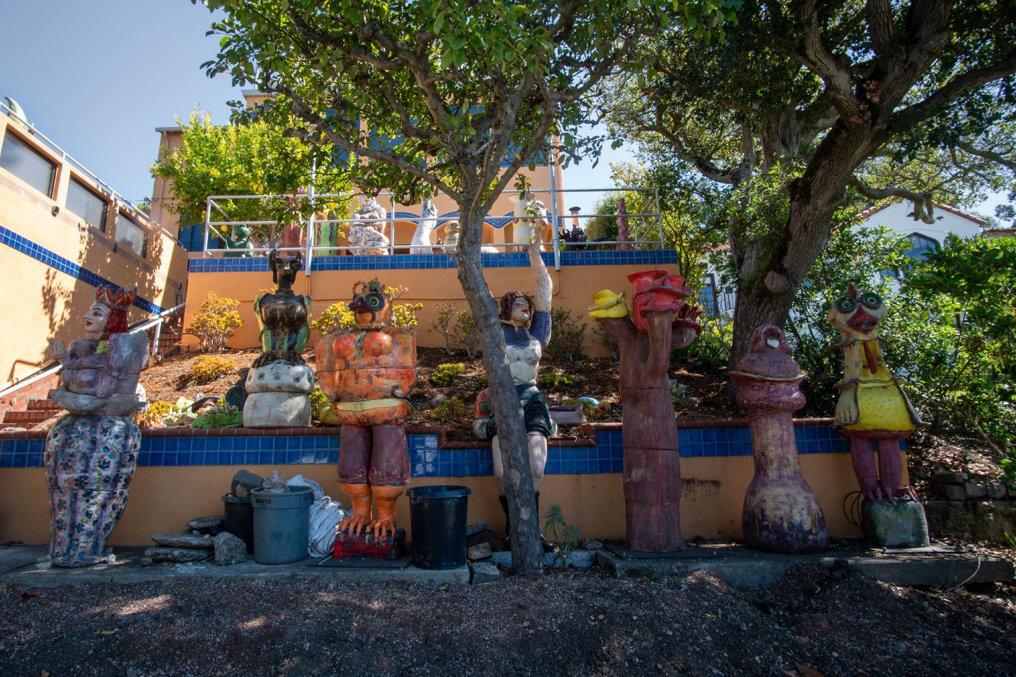 Large clay sculptures in front of a house