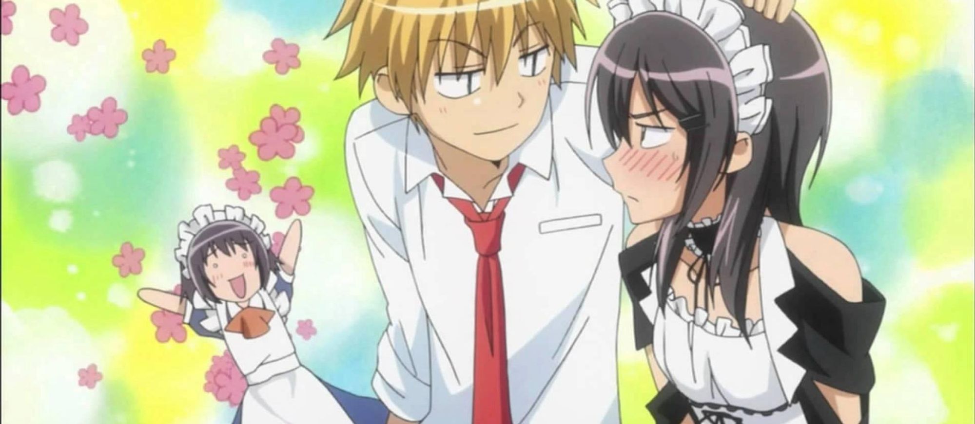 A Kaichou wa Maid Sama screenshot, where Usui is petting Misaki's head while she's blushing. Her boss is in the background, chibi style, cheering for them.