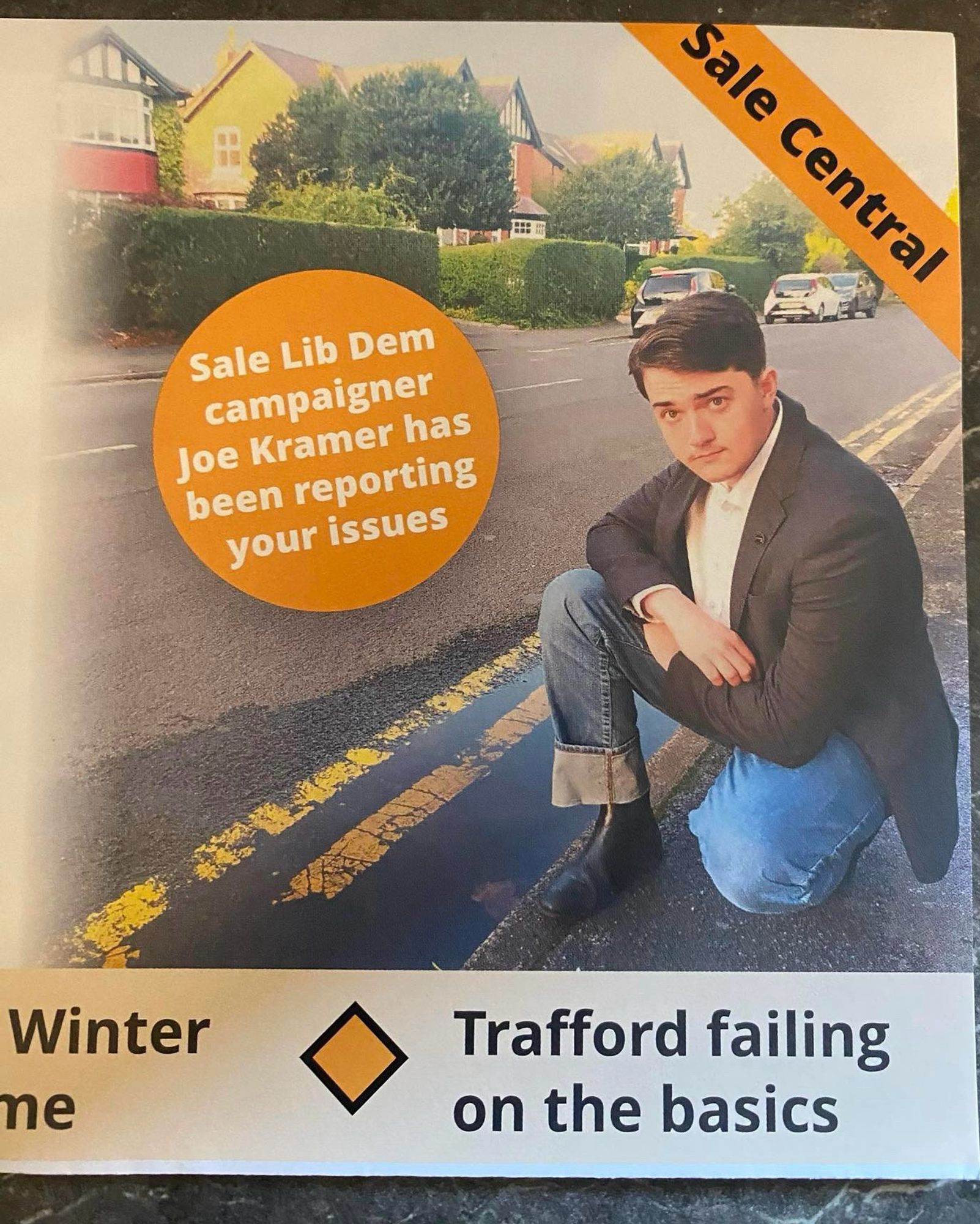 A Lib Dem leaflet of a Harry Potter lookalike kneeling by a potholed road.