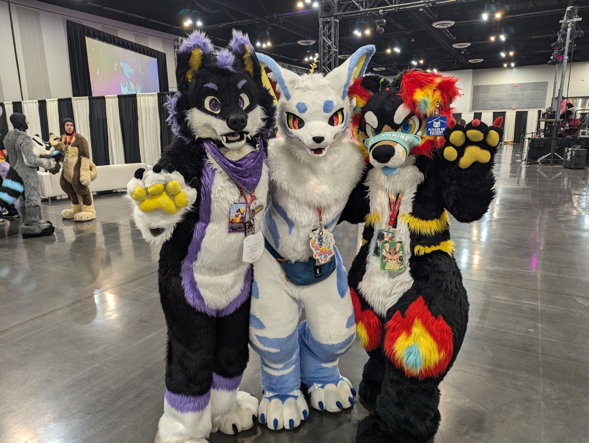 Blazi the wolf, Pajra the dog of wisdom, and Torchy the fire dog posing.