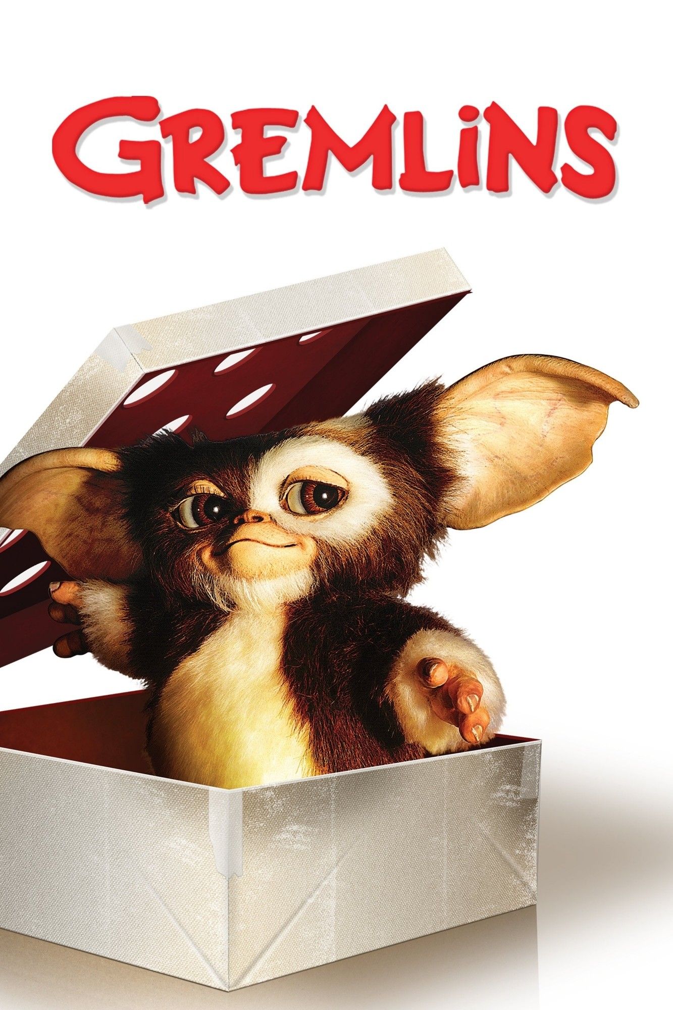 Poster for gremlins. White background with title in red at the top. A close up of gizmo standing in a white box, pushing the holed lid off of him. Gizmo is a mogwai in furry form. He has brown and white fur, white tracing his big belly up to his chin, and continuing past his nose to circle his left eye, while the right remains coated in brown. He also has white fur at the ends of his sleeves from which protrude stubby 3 fingered hands. He has wide leathery ears sticking out from the sides of his head. His brown eyes peer toward the right side of the frame. The whole poster is in a hand painted hyper-realistic style.